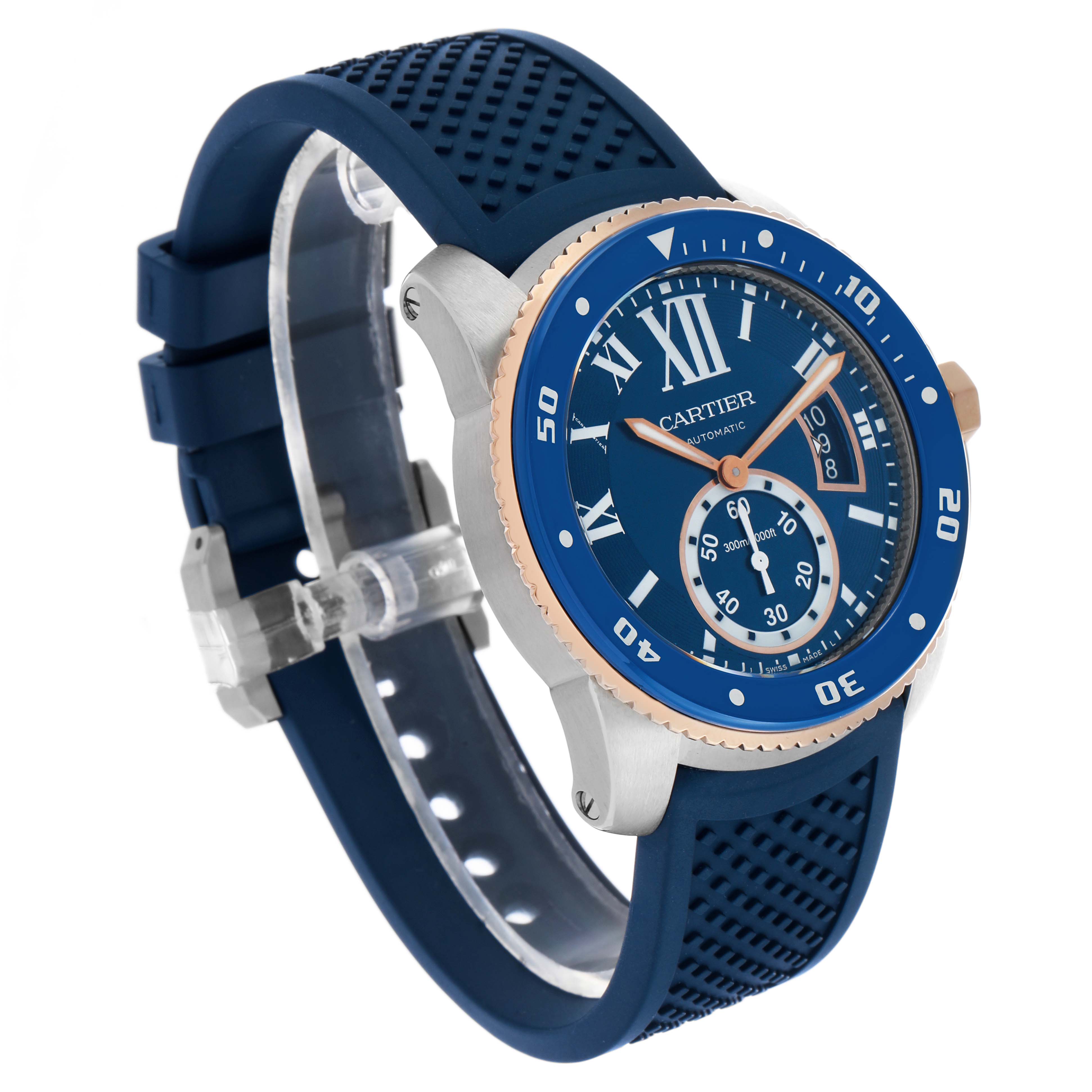 The Calibre de Cartier watch is shown at a slight angle, displaying its blue dial, bezel, and textured blue strap.