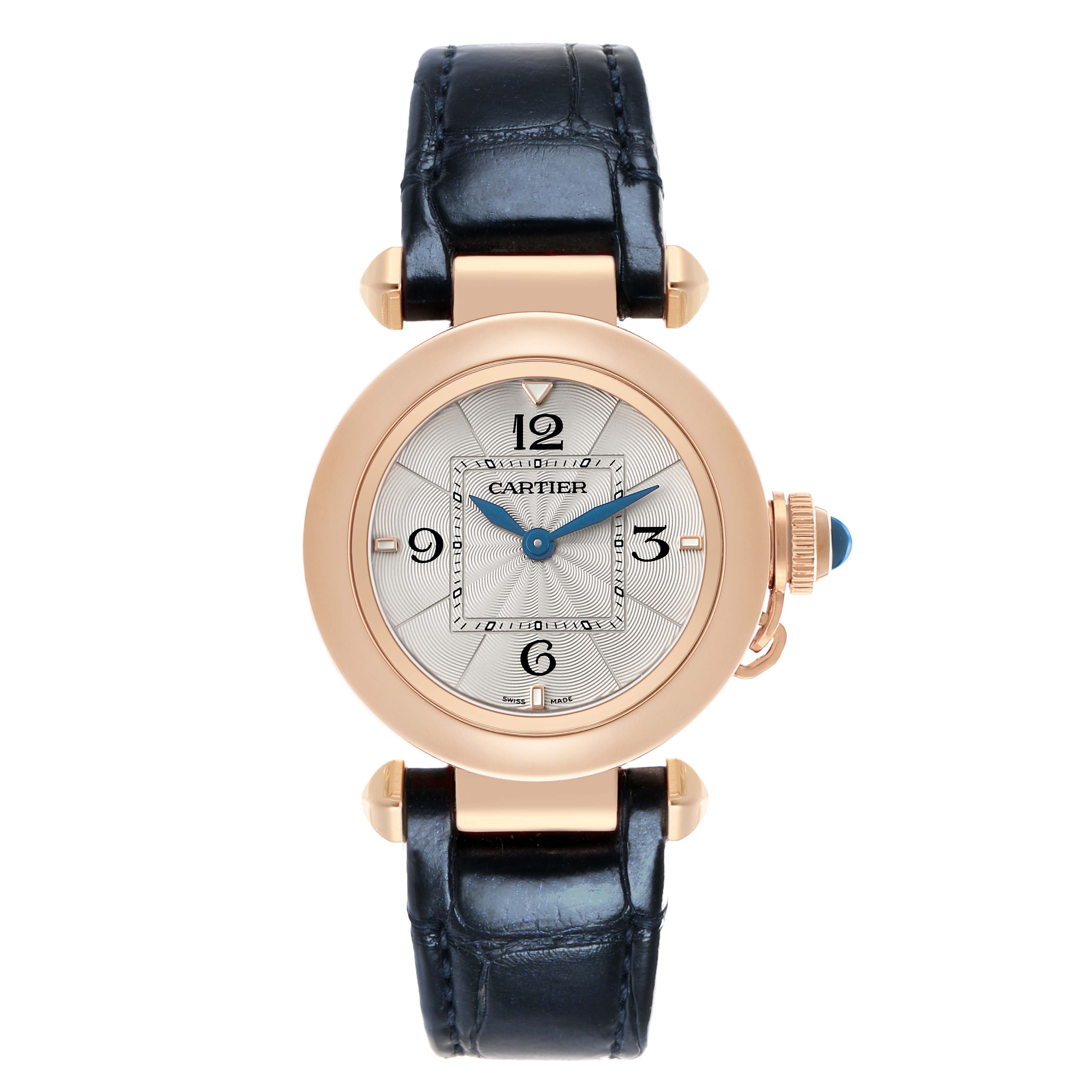 The Cartier Pasha WGPA0018 Women's Rose Gold Silver Dial watch is shown from a top-down angle, displaying its round face, blue hands, and leather strap.