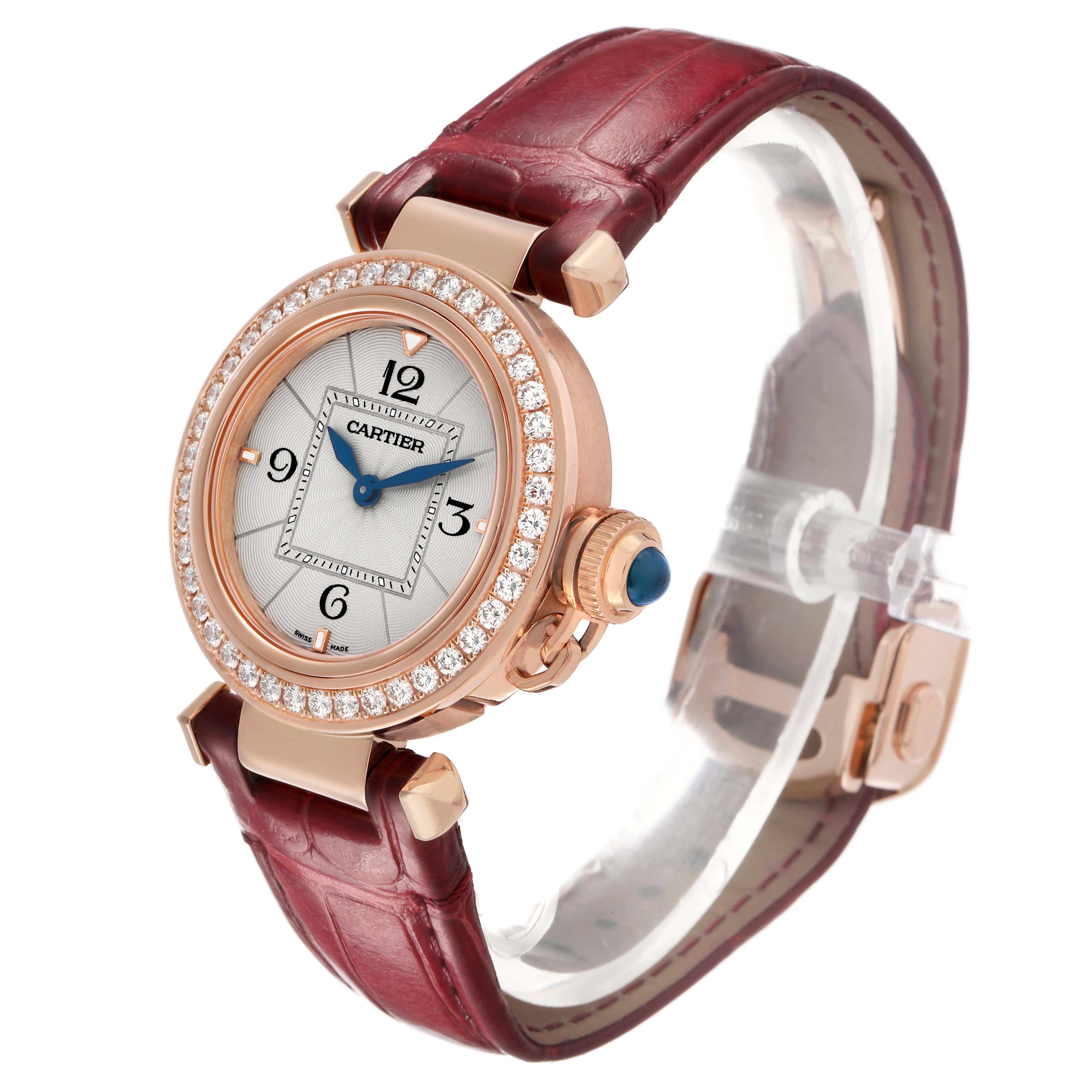 The Cartier Pasha WJPA0017 Women's Rose Gold Silver Dial watch is shown at a three-quarter angle, highlighting the case, bezel, crown, and leather strap.