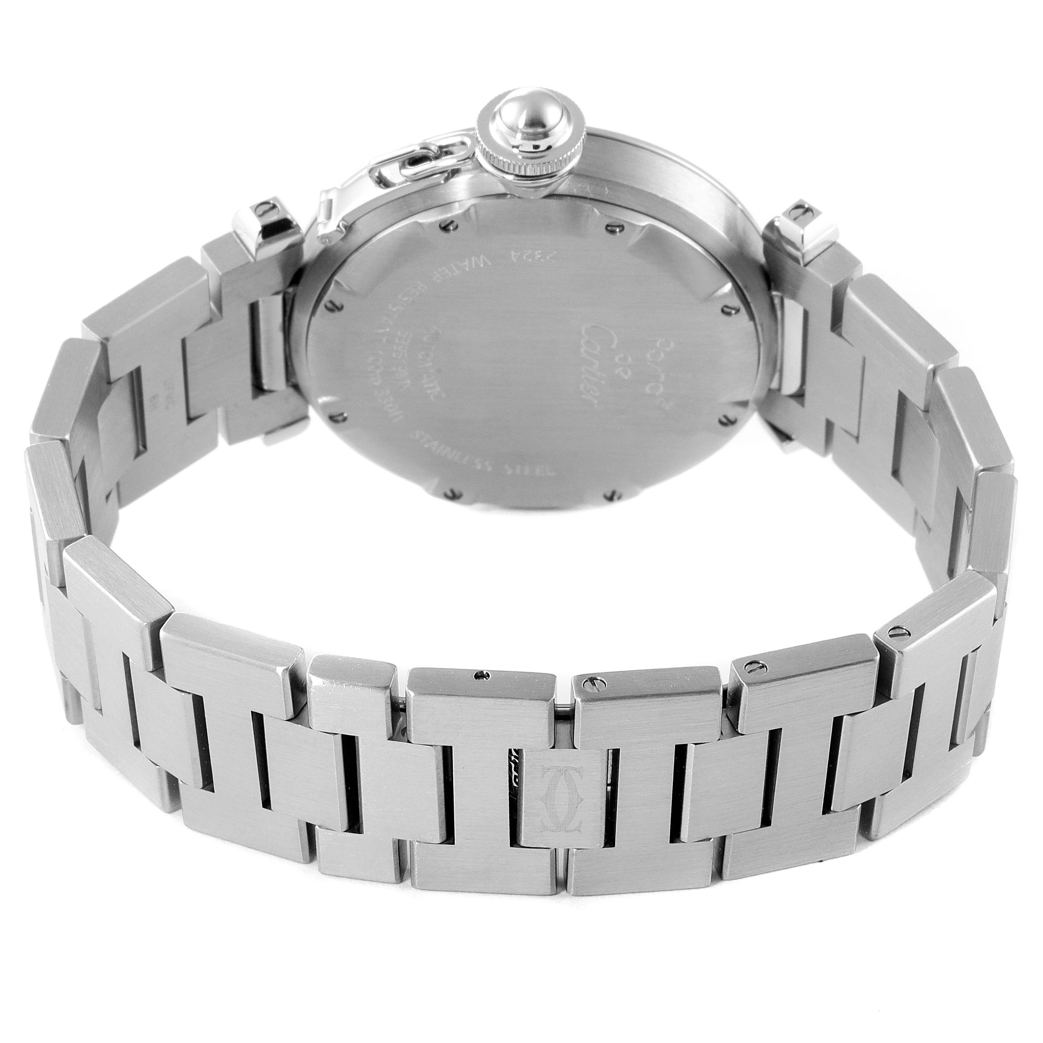 The image shows the back view of a Pasha by Cartier watch, highlighting its stainless steel case and bracelet.