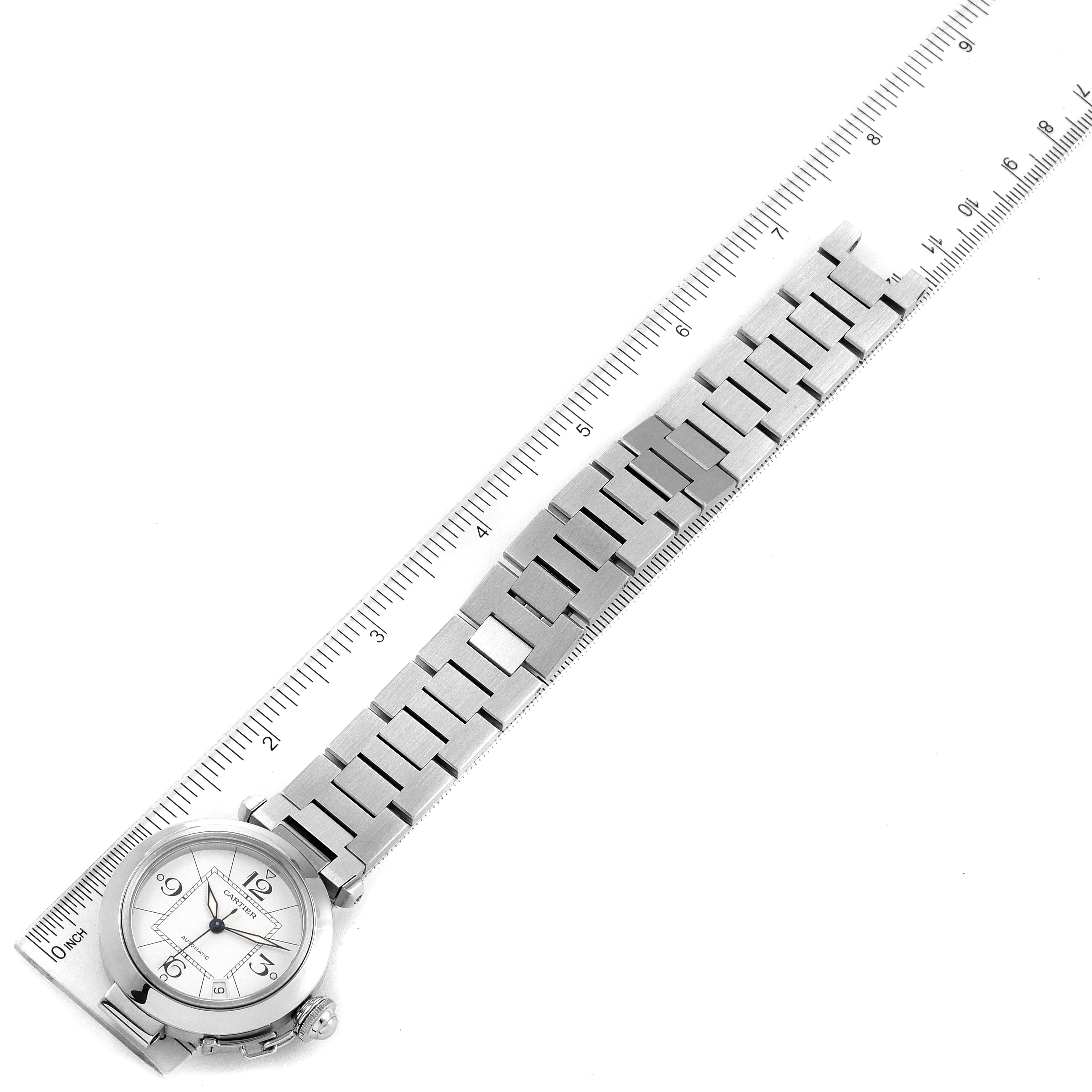 The image shows a Cartier Pasha W31074M7 Men's Stainless Steel White Dial W31074M7 Men's Stainless Steel White Dial watch laid flat with a metal bracelet and a ruler measuring its length.