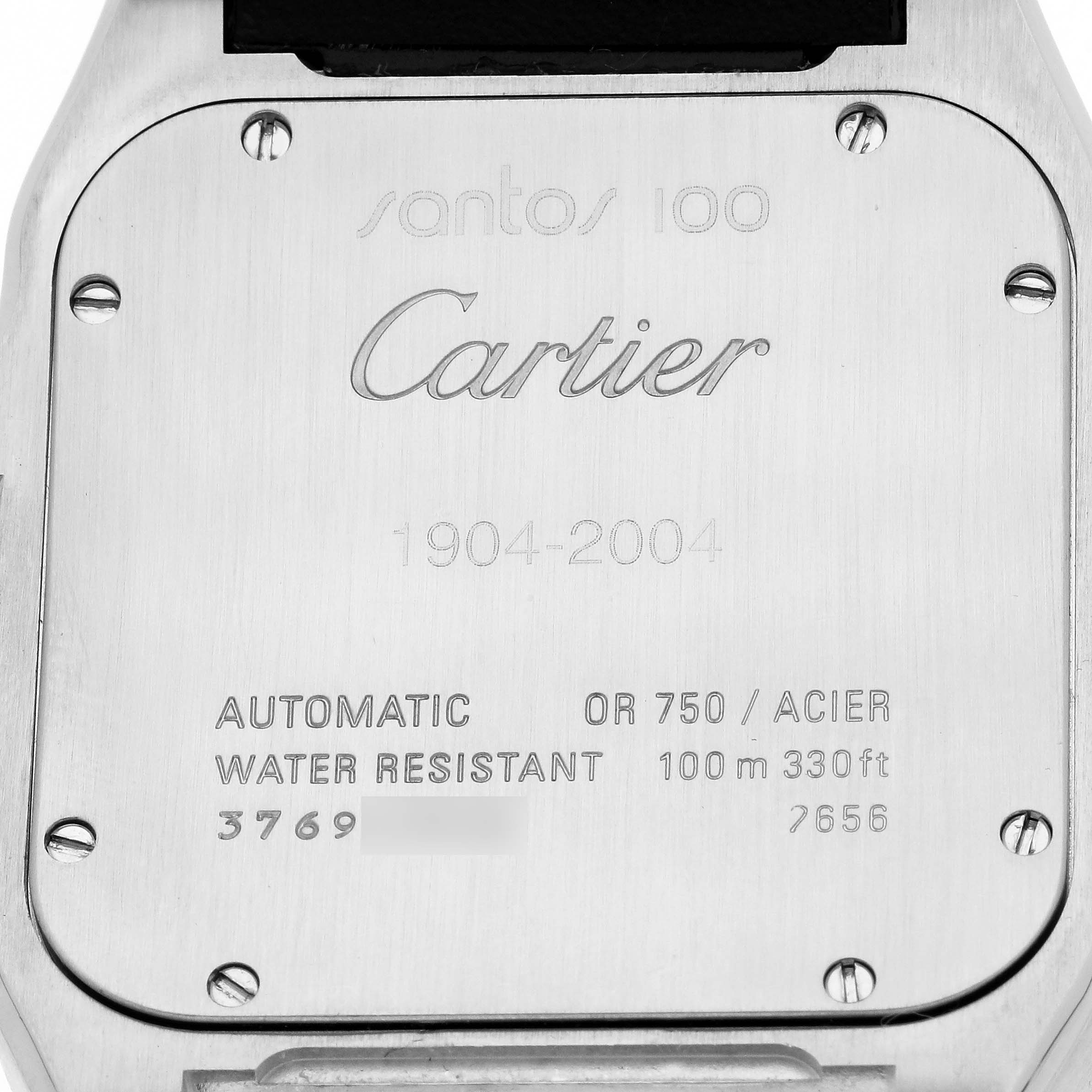 The image shows the back of a Cartier Santos W20072X7 Men's Stainless Steel Silver Dial 100 watch, highlighting the engraved details and screws.