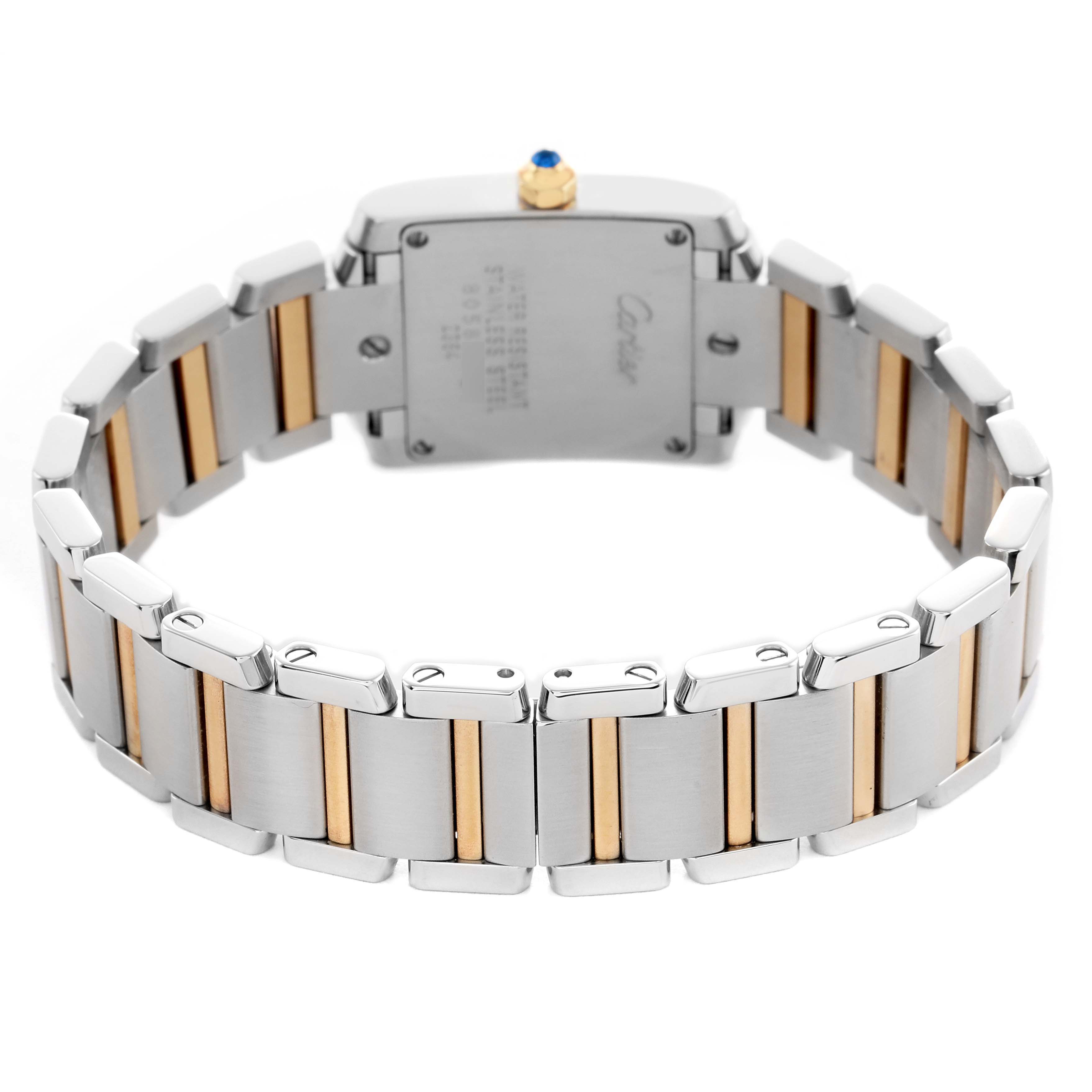 The image shows the back of a Cartier Tank Francaise W51007Q4 Women's Steel and Gold (two tone) Silver Dial watch with its two-tone metal bracelet and engraved case back.