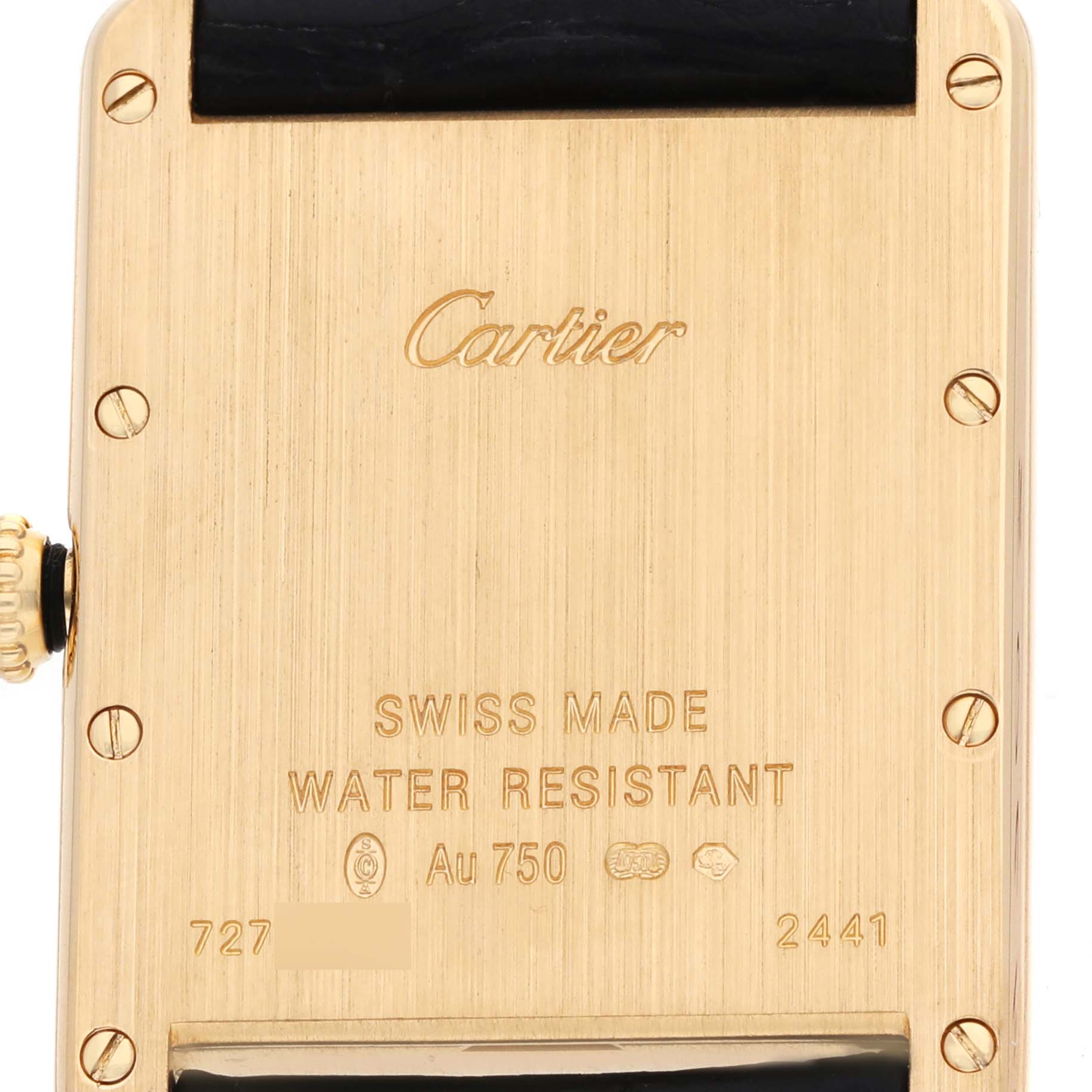 The image shows the back case of a Cartier Tank Louis W1529756 Men's Yellow Gold Silver Dial watch, highlighting the inscriptions and screws.