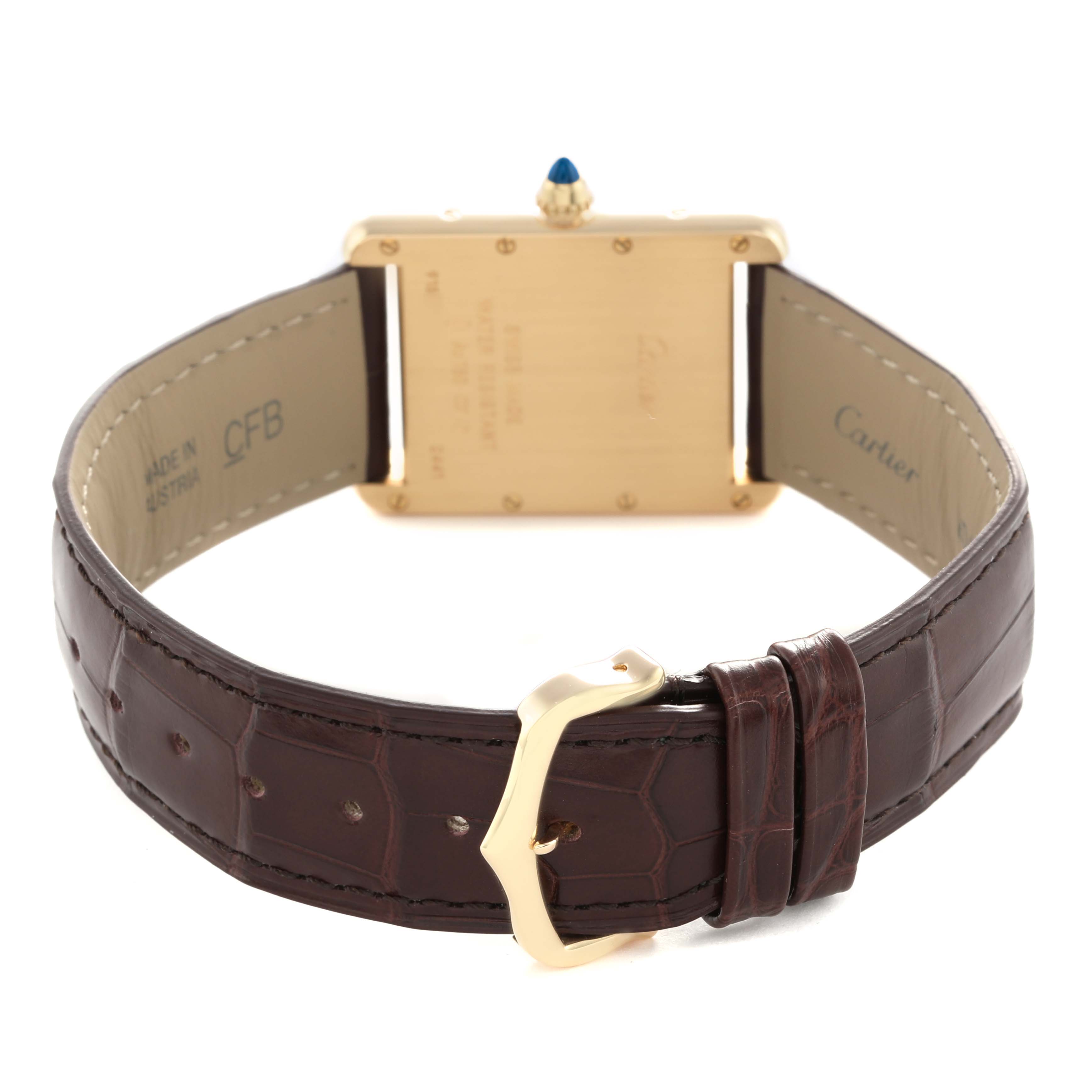 The Cartier Tank Louis W1529756 Men's Yellow Gold Silver Dial watch is shown from the back, highlighting its case, strap, buckle, and crown.