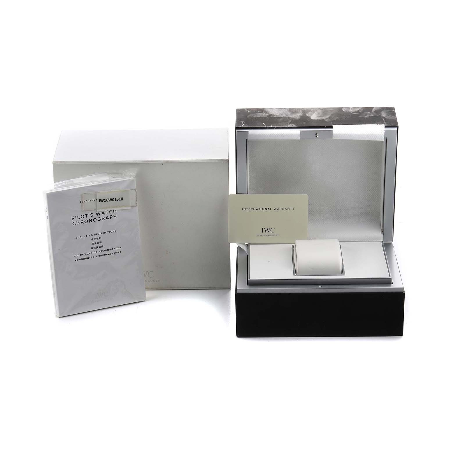 The image shows the packaging and accessories for an IWC Pilot IW377710 Men's Stainless Steel Black Dial model, including the box, manual, and warranty card.