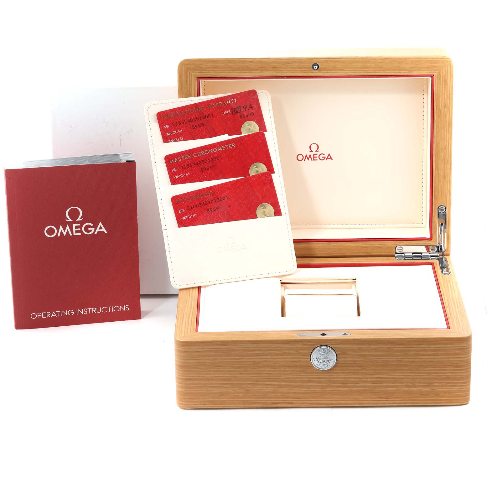 The image shows the Omega Planet Ocean 215.62.40.20.13.001 Men's Ceramic Brown Dial watch's open wooden box, instruction manual, and warranty cards.