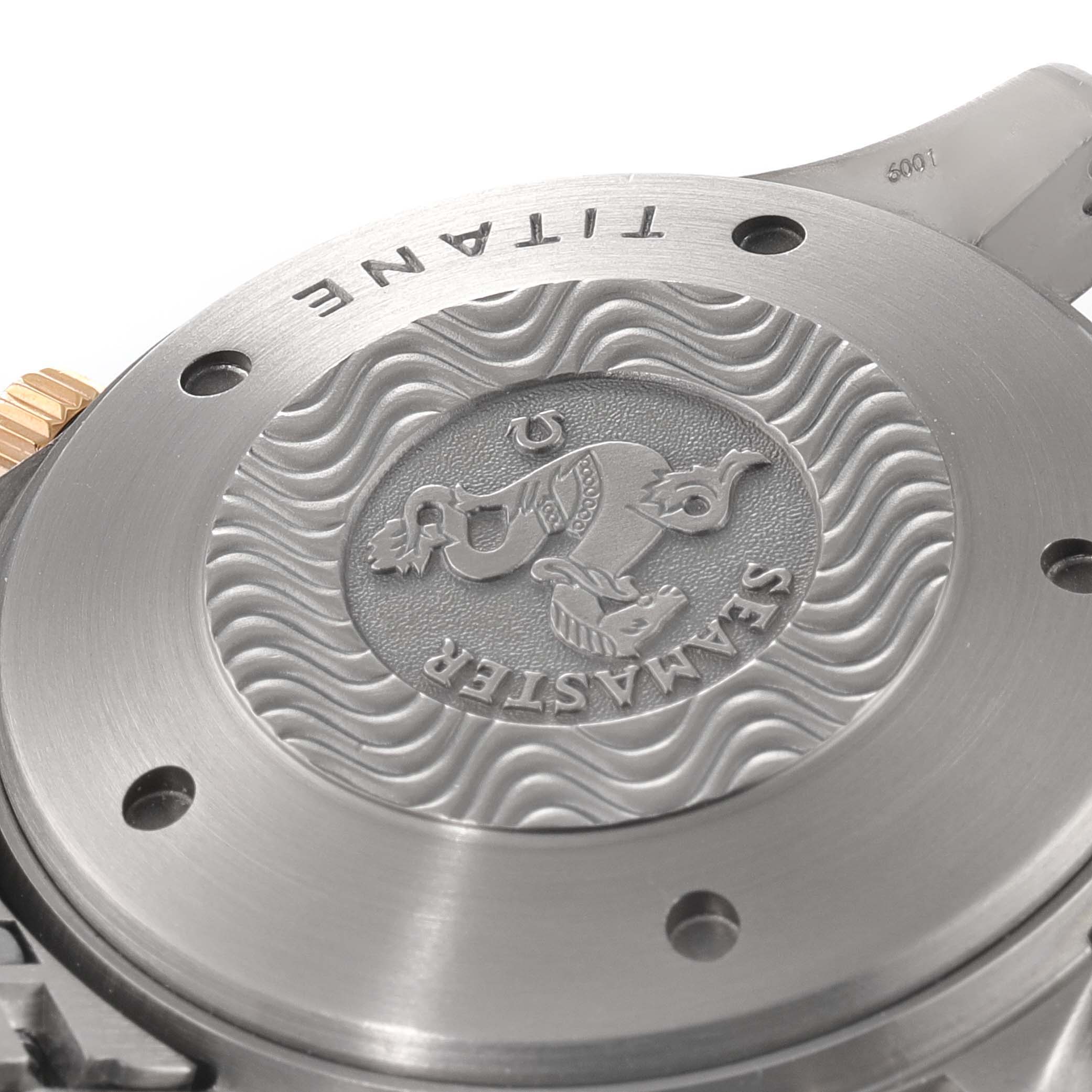 This image shows the titanium case back of an Omega Seamaster 2296.80.00 Men's Titanium Blue Dial 2296.80.00 Men's Titanium Blue Dial watch at a close-up angle.