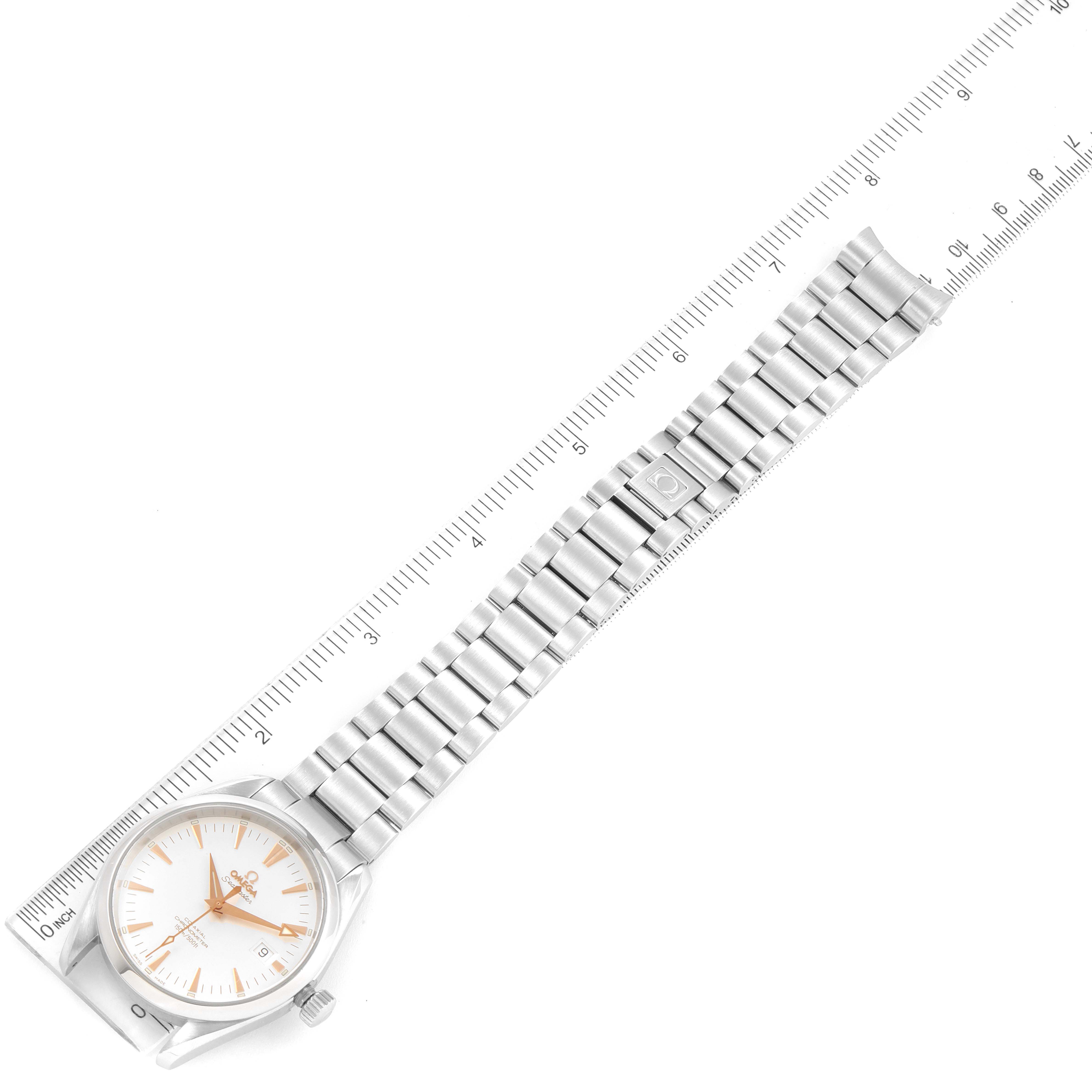 The Omega Aqua Terra 2503.34.00 Men's Stainless Steel Silver Dial 2503.34.00 Men's Stainless Steel Silver Dial watch is shown from an overhead angle with its face, bracelet, and clasp in view along a ruler.