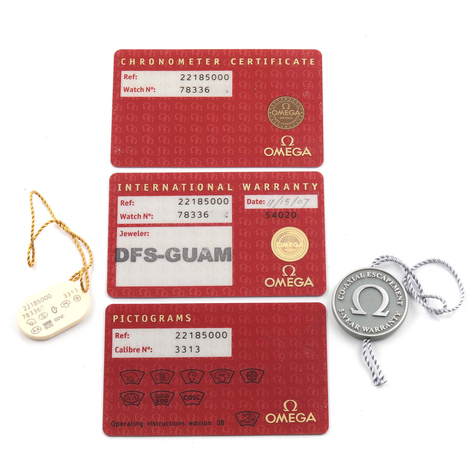 The image shows various certifications and accessories for an Omega Planet Ocean 2218.50.00 Men
s Stainless Steel Black Dial 2218.50.00 Men
s Stainless Steel Black Dial model watch, including chronometer certificate, warranty card, pictograms, and tags.