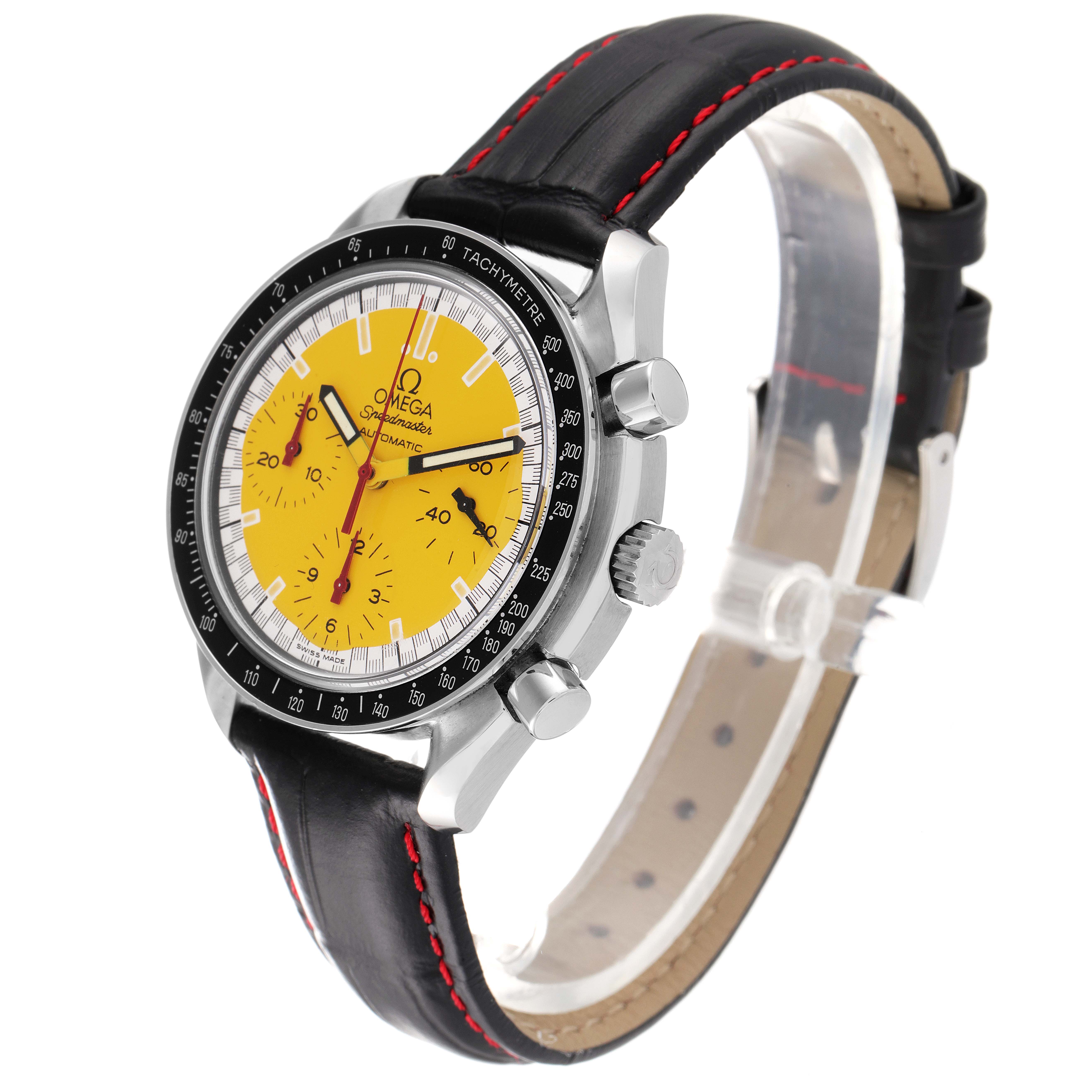 The image shows the Omega 3810.80.00 Men
s Stainless Steel Yellow Dial 3810.80.00 Men
s Stainless Steel Yellow Dial Speedmaster Schumacher Yellow Dial Automatic Watch 3810.12.00 from a three-quarter angle, highlighting its dial, case, and strap.