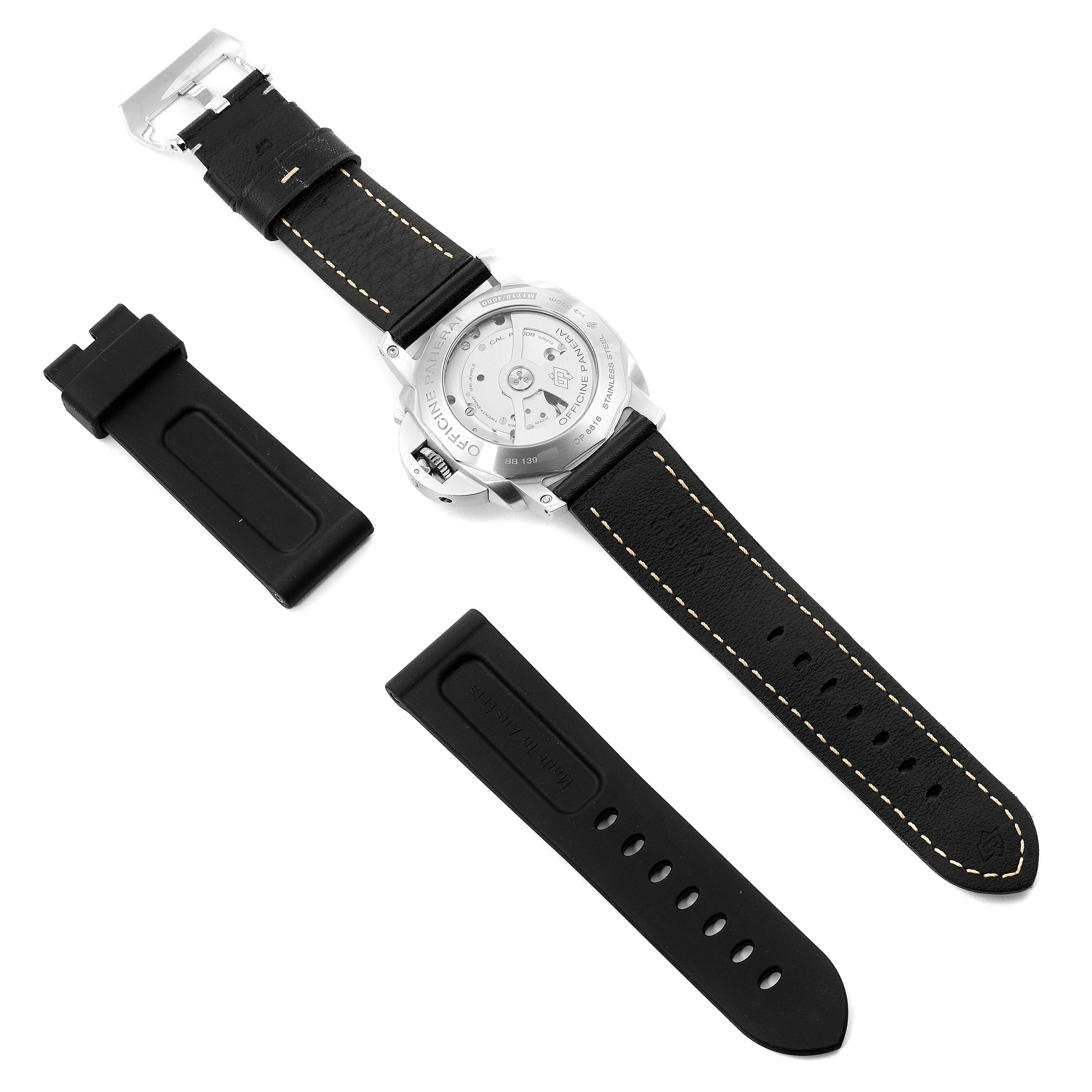 The image shows the back view of a Panerai Luminor PAM00312 Men
s Stainless Steel Black Dial PAM00312 Men
s Stainless Steel Black Dial watch with additional black straps laid beside it.