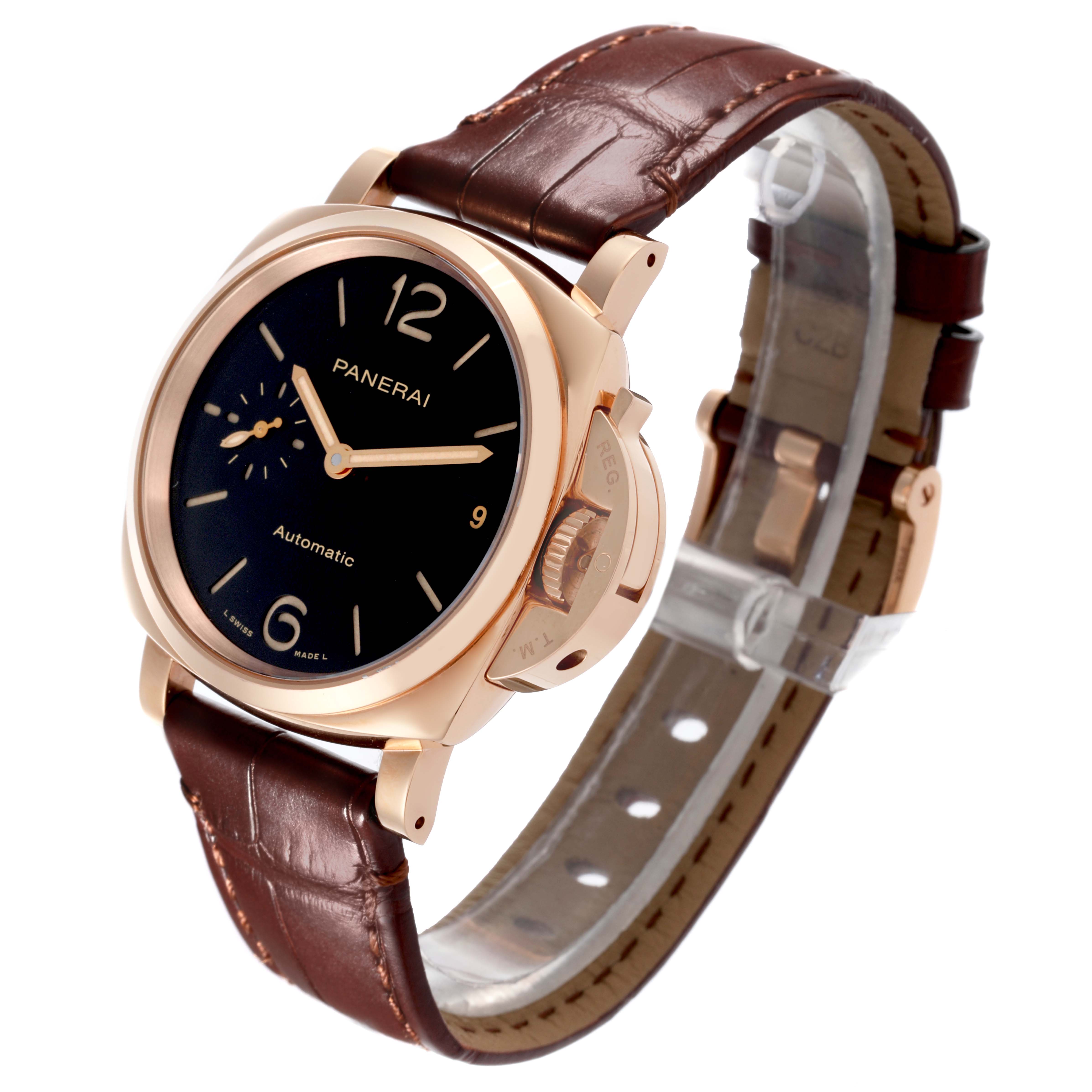 The Luminor by Panerai is shown at an angle displaying the dial, crown guard, and leather strap.