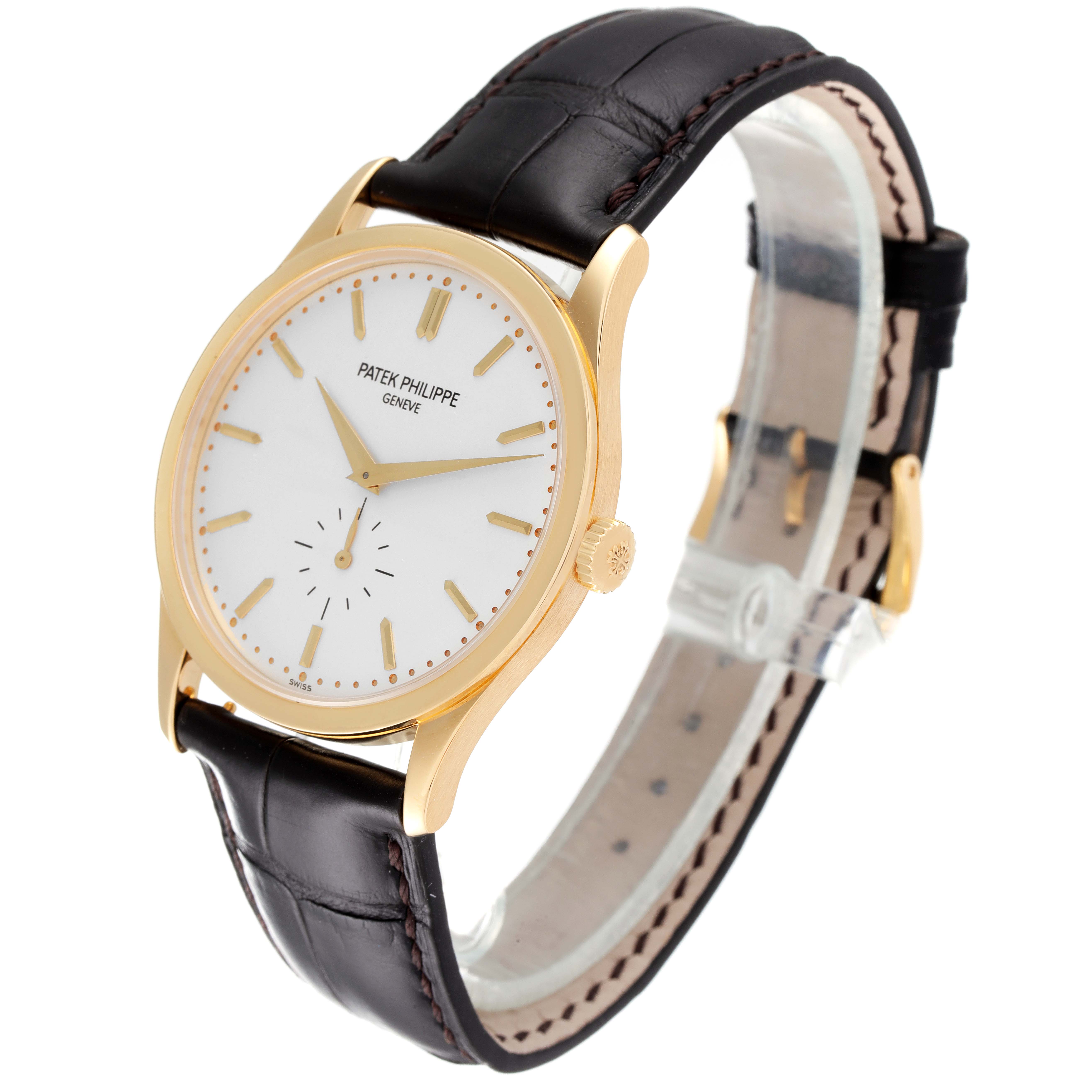 The Patek Philippe Calatrava 5196J Men's Yellow Gold Silver Dial 5196J Men's Yellow Gold Silver Dial watch is shown at a three-quarter angle, highlighting its face, crown, and leather strap.