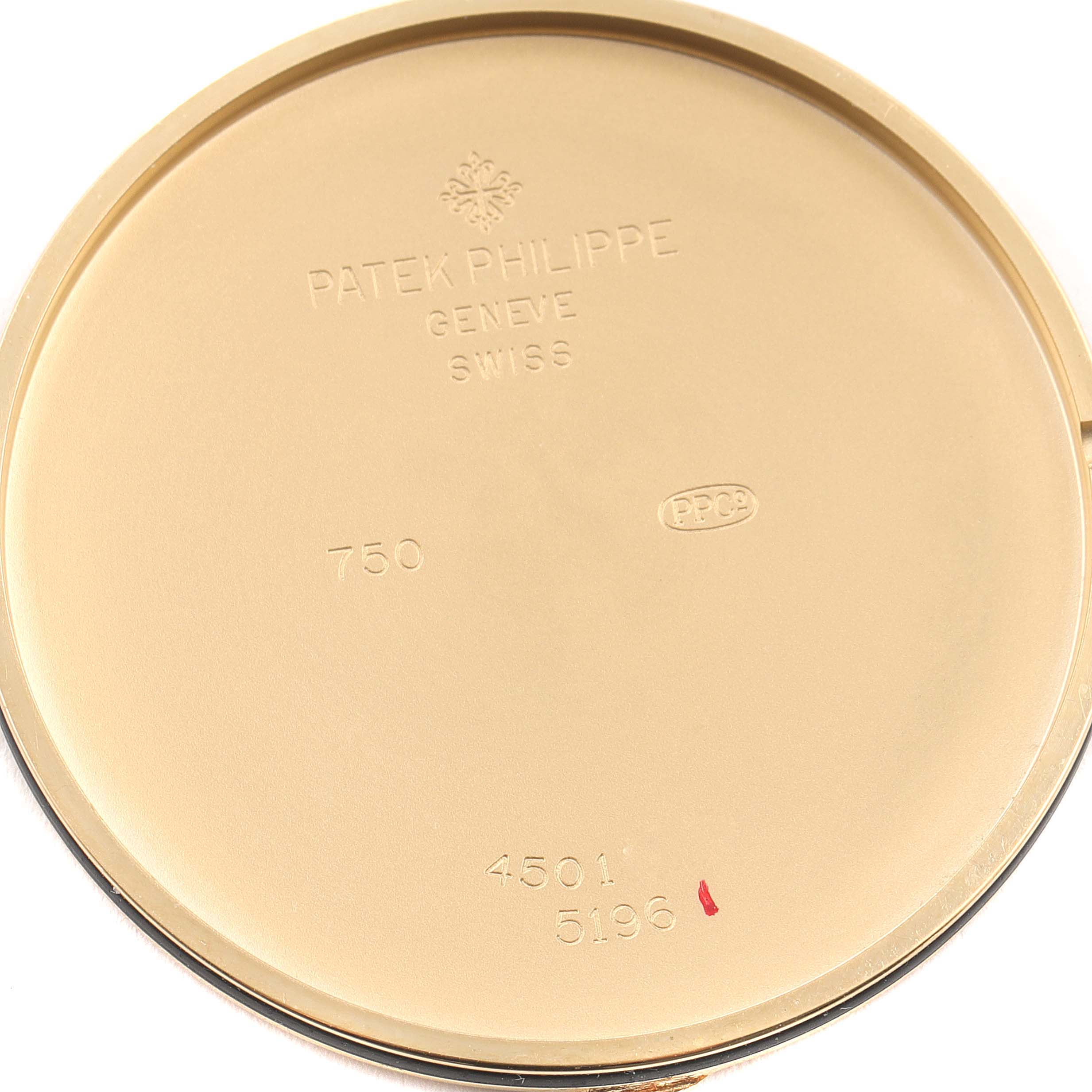 The image shows the interior case back of a Patek Philippe Calatrava 5196J Men's Yellow Gold Silver Dial 5196J Men's Yellow Gold Silver Dial watch, displaying the brand's engravings and model number.