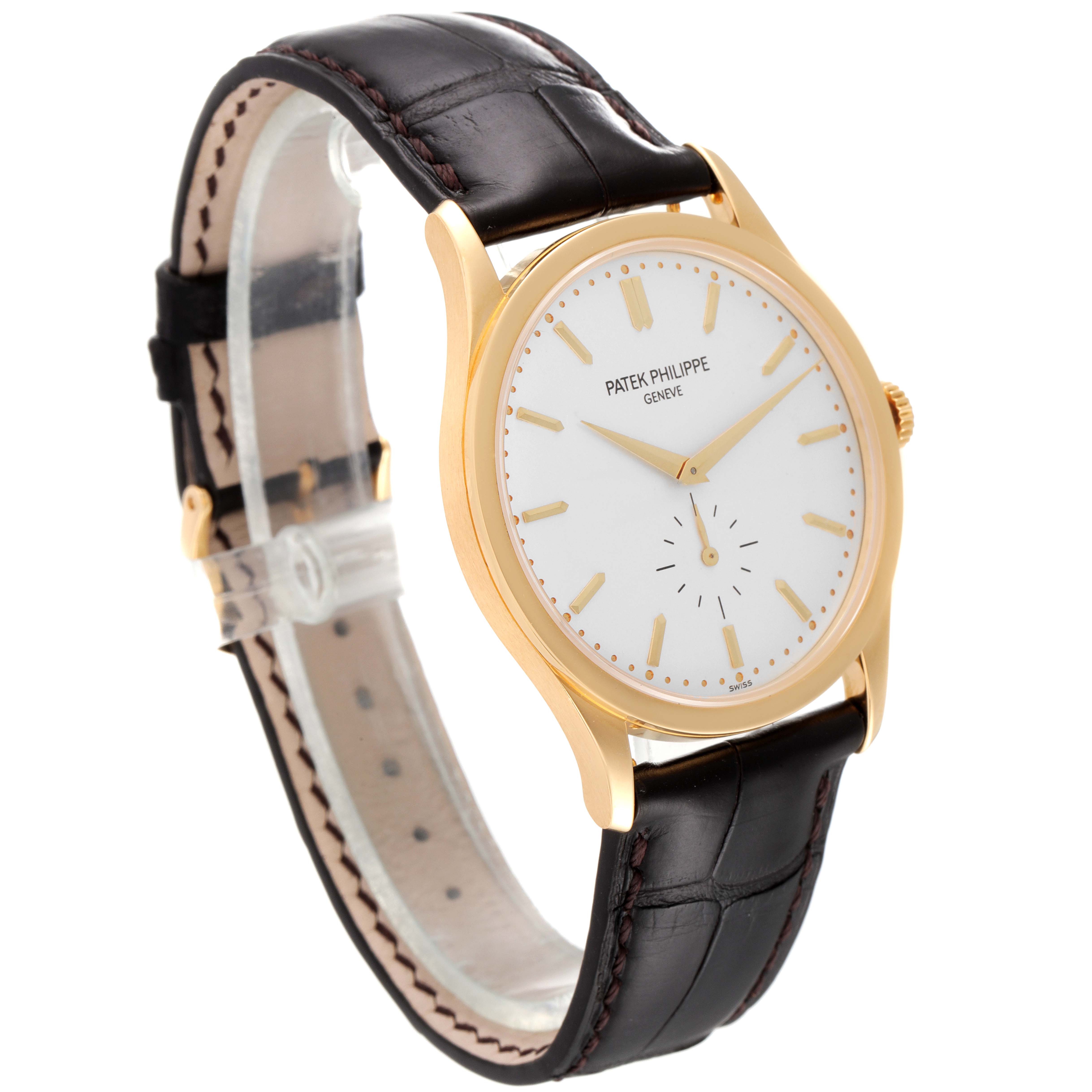The image shows a Patek Philippe Calatrava 5196J Men's Yellow Gold Silver Dial 5196J Men's Yellow Gold Silver Dial watch taken from an angled side view, displaying the watch face, case, and strap.
