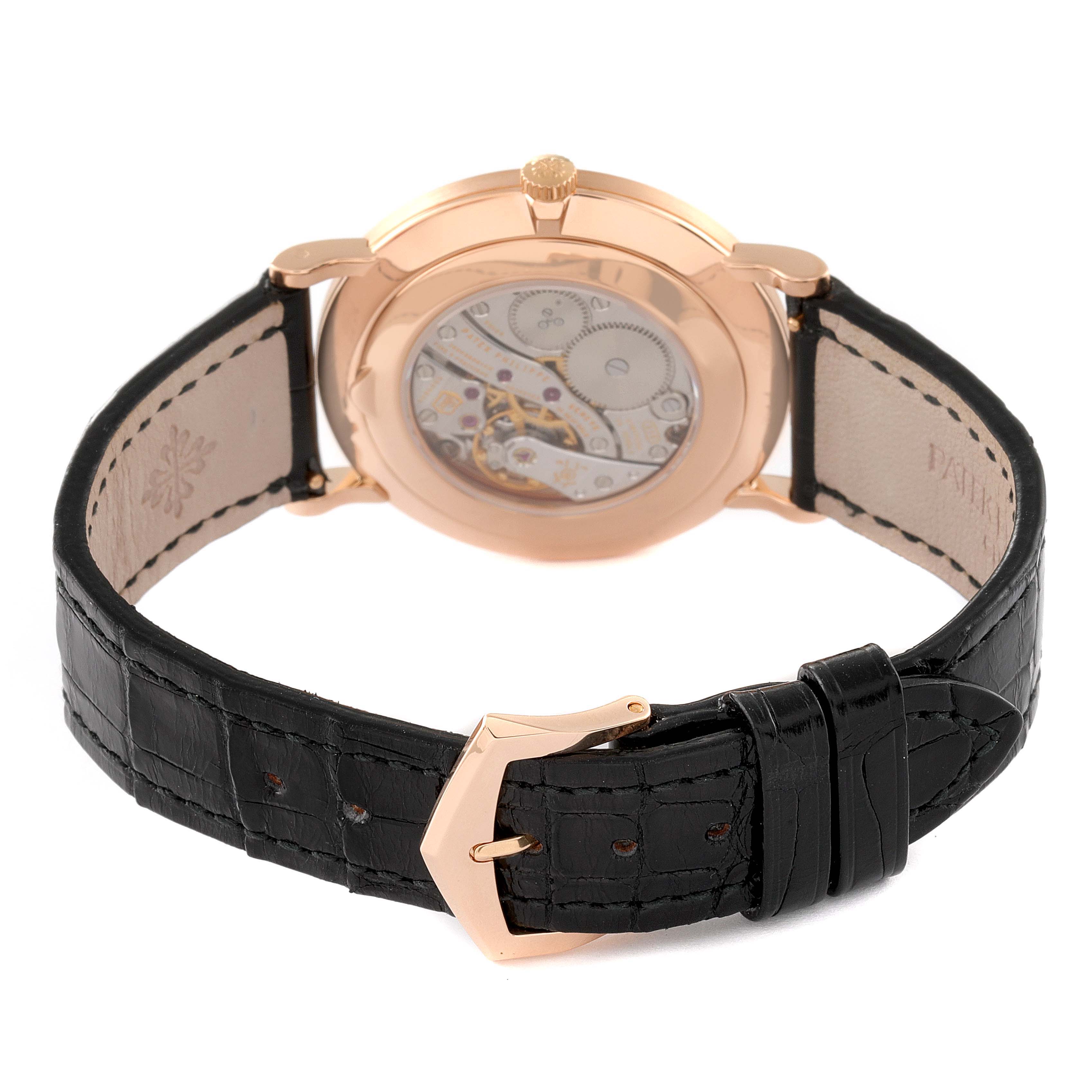 This image shows the back view of a Calatrava model by Patek Philippe, highlighting its leather strap and mechanical movement.