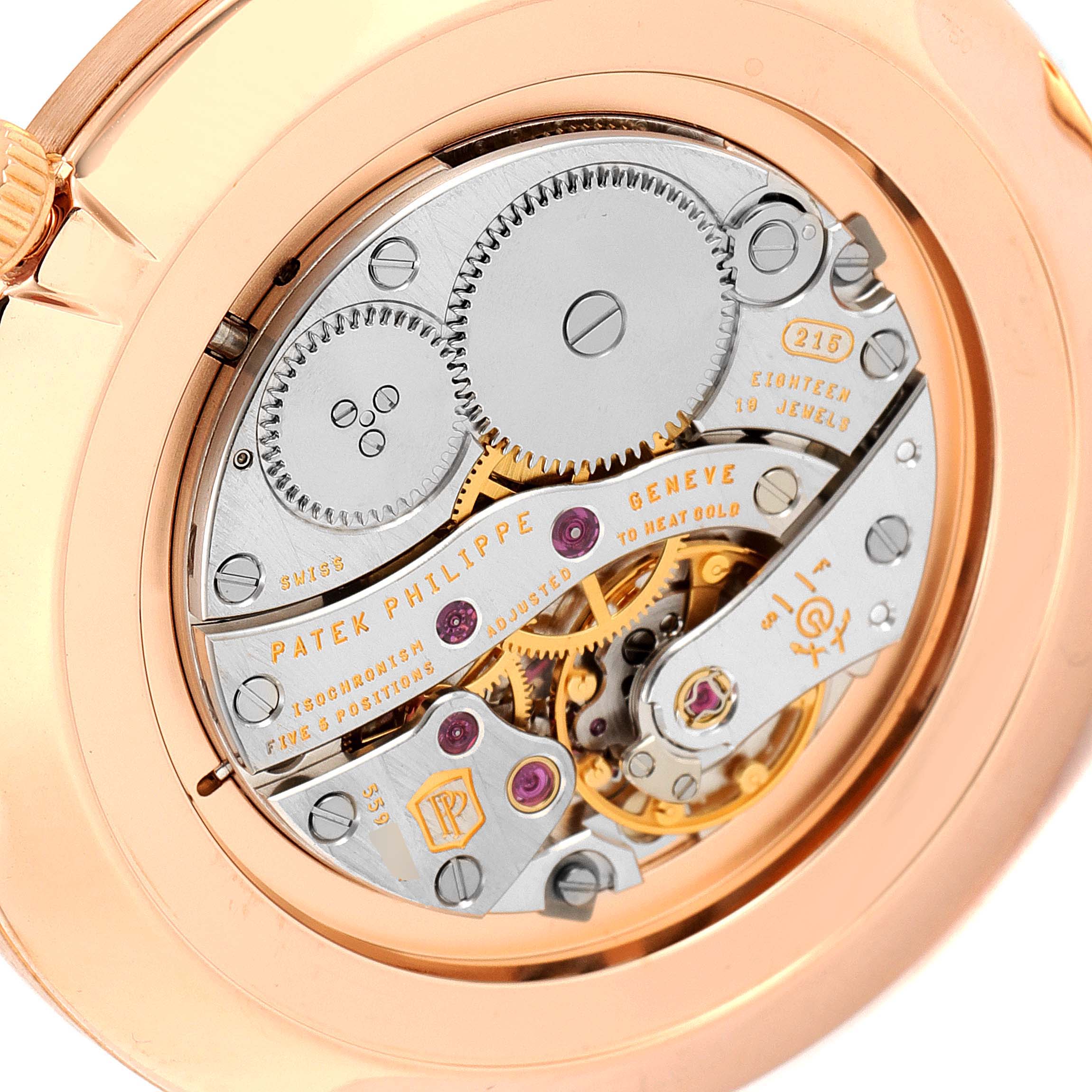 The image shows the exposed movement of a Patek Philippe Calatrava 5119R Men's Rose Gold White Dial 5119R Men's Rose Gold White Dial watch from the back, highlighting the intricate gears and components.