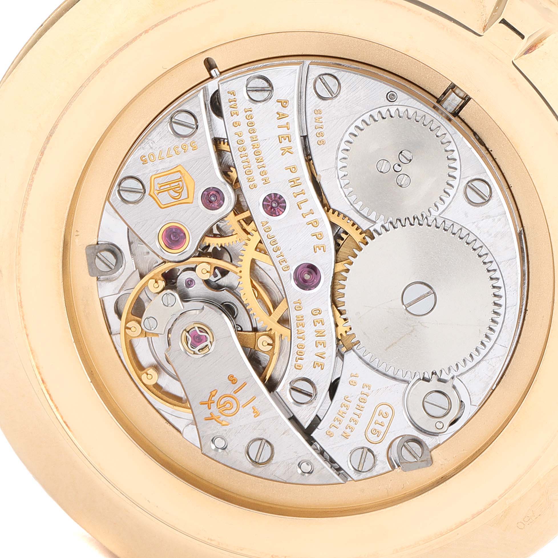 The image shows the back of a Patek Philippe Calatrava 5119J Men's Yellow Gold White Dial 5119J Men's Yellow Gold White Dial watch, featuring its exposed mechanical movement.