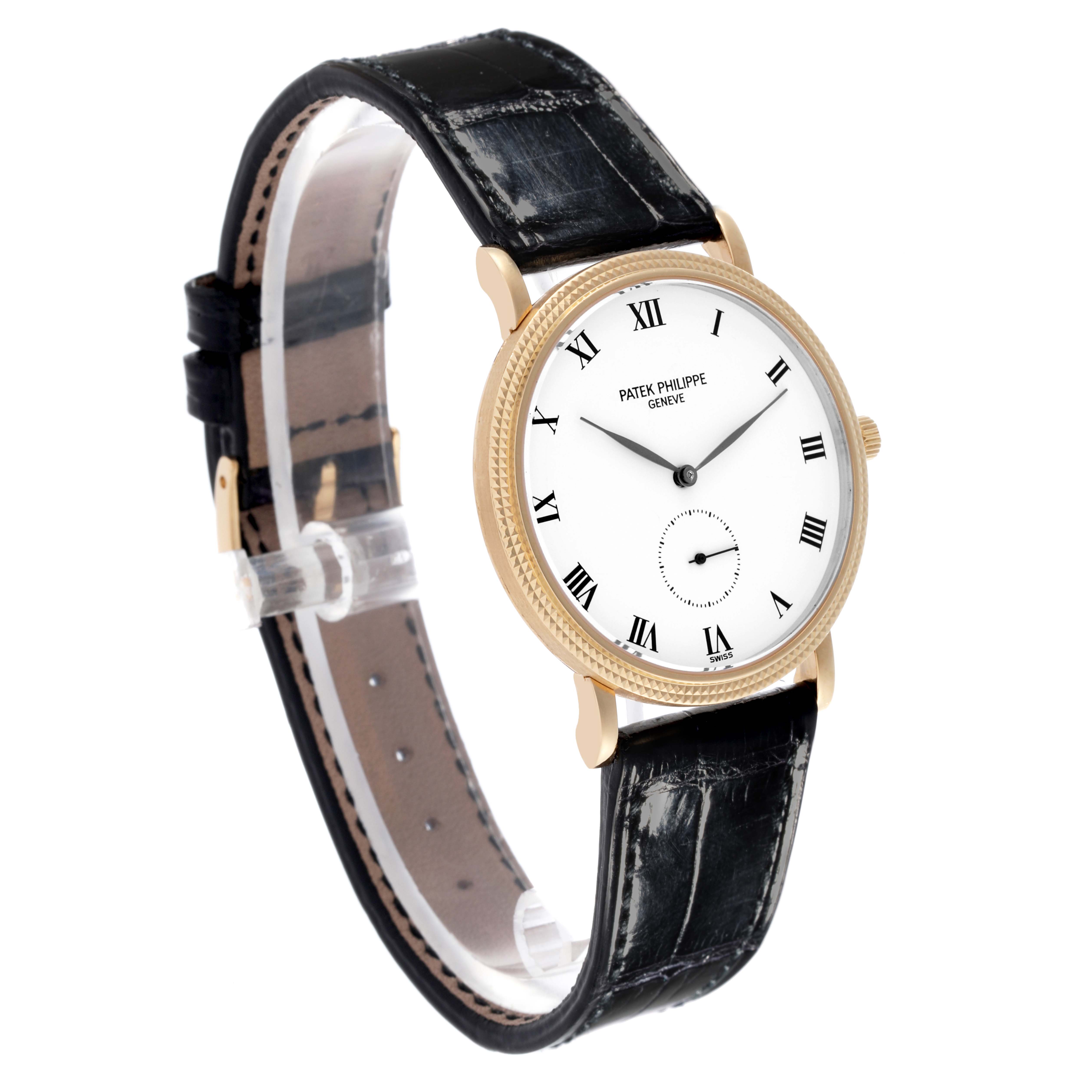 The Patek Philippe Calatrava 3919J Men's Yellow Gold White Dial 3919J Men's Yellow Gold White Dial watch is shown at an angled side view, displaying its face, case, lugs, and part of the strap.