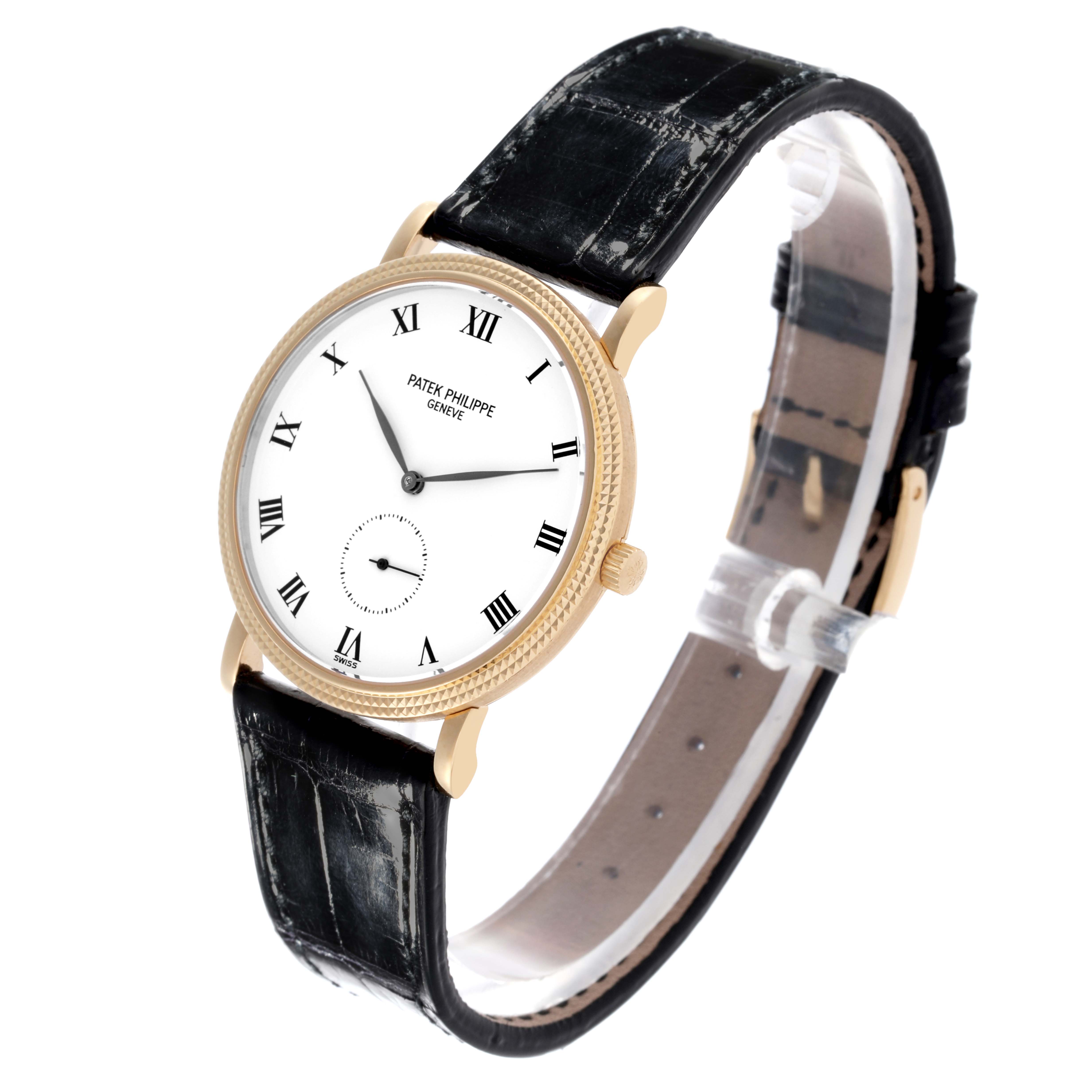 The Patek Philippe Calatrava 3919J Men's Yellow Gold White Dial 3919J Men's Yellow Gold White Dial watch is shown at a slight angle, highlighting the dial, case, crown, and strap.