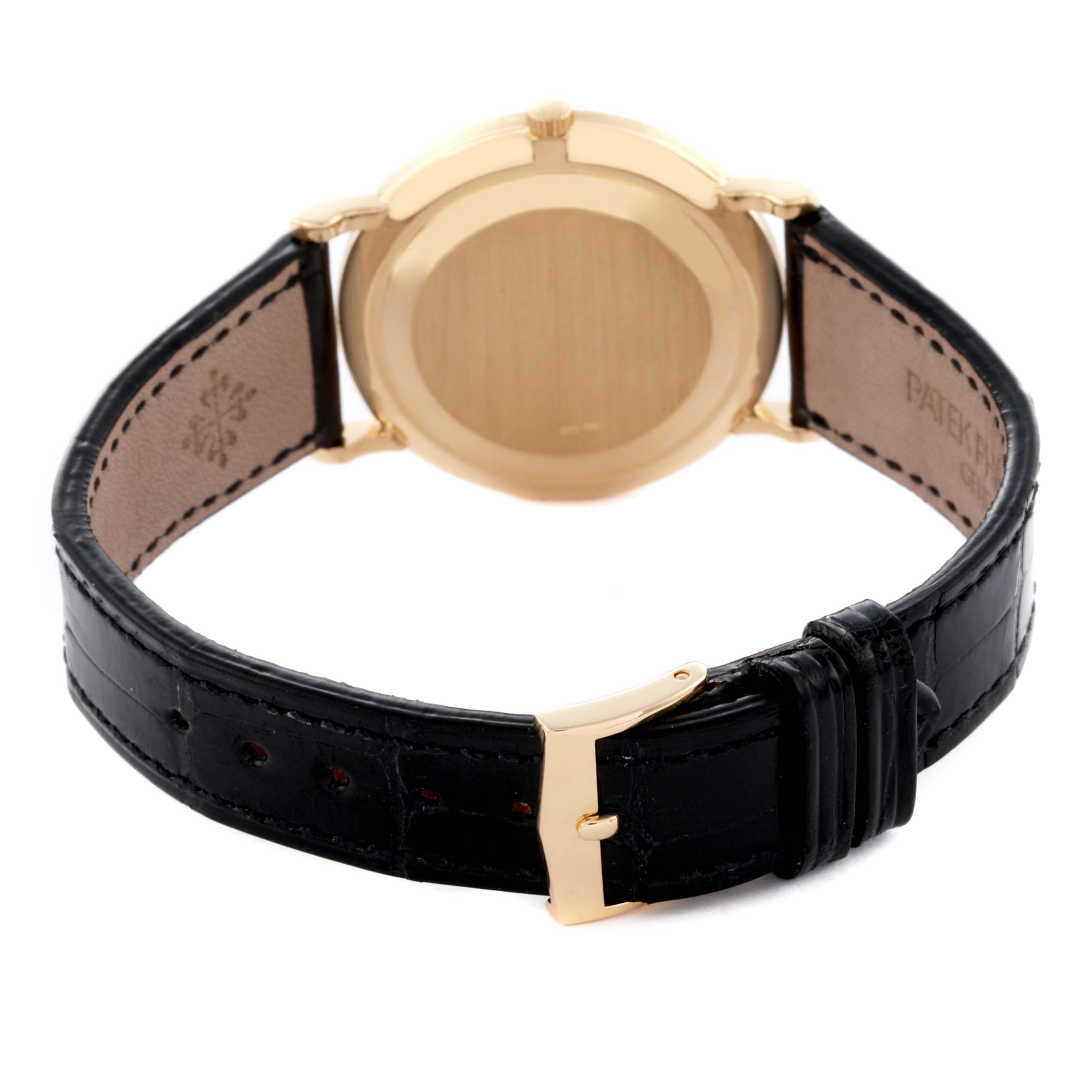 The image shows the back view of a Patek Philippe Calatrava 3919J Men's Yellow Gold White Dial 3919J Men's Yellow Gold White Dial watch, highlighting the case back and leather strap.