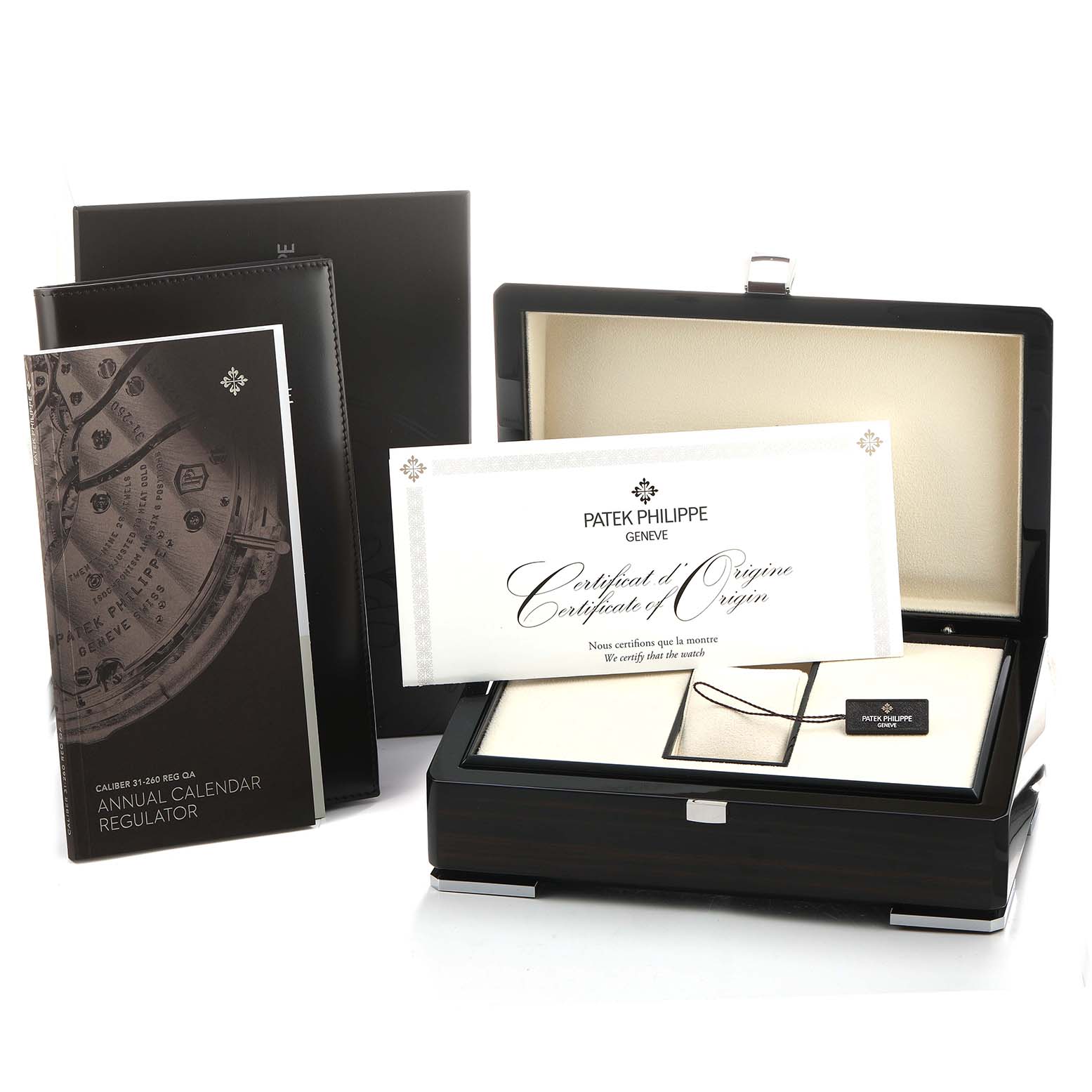 The image shows a Patek Philippe Complications 5235/50R-001 Men's Rose Gold Grey Dial watch box at an angle, with a certificate of origin and manuals displayed.