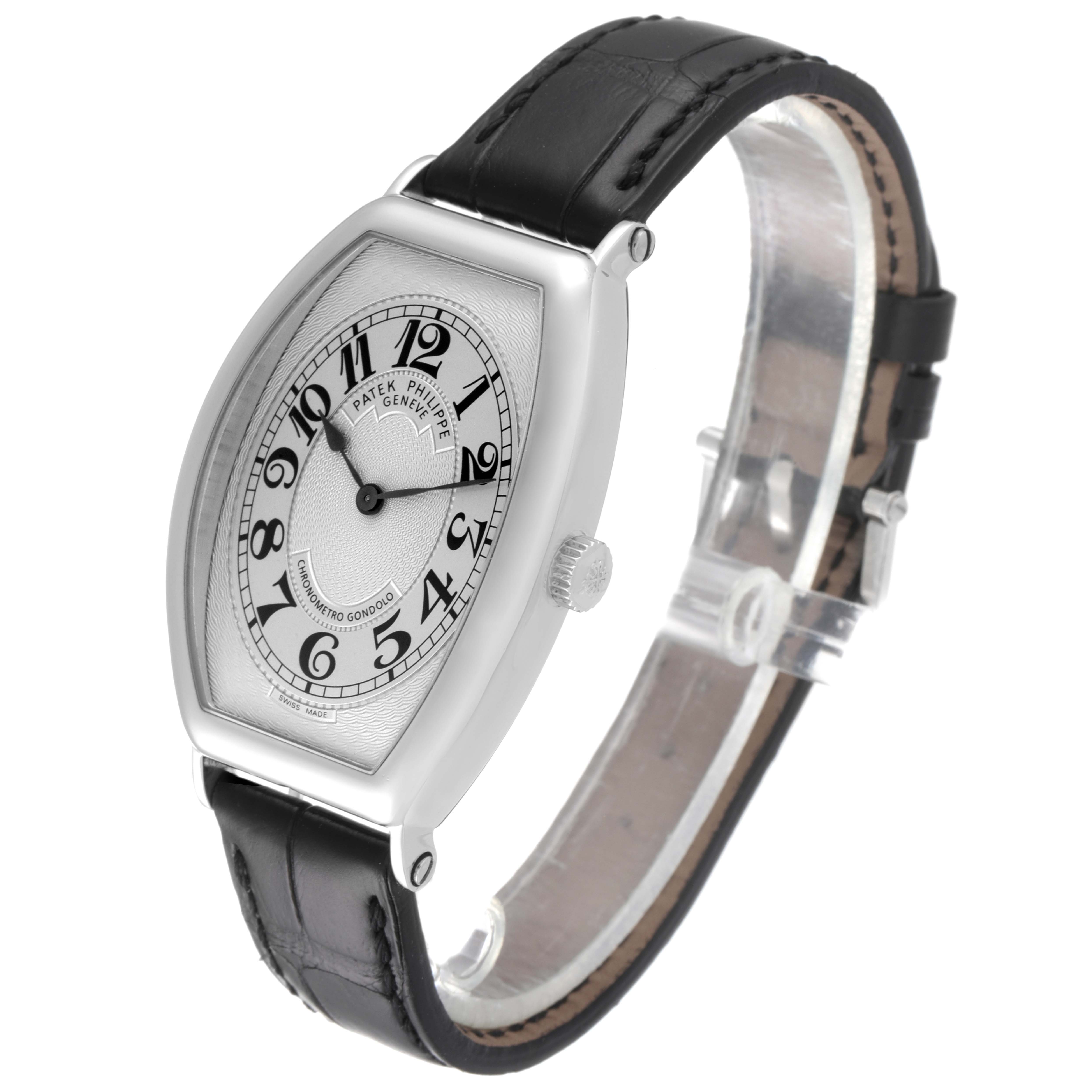The image shows a Patek Philippe Gondolo 5098P Men's Platinum Silver Dial 5098P Men's Platinum Silver Dial watch from a side angle, highlighting the face, bezel, crown, and leather strap.