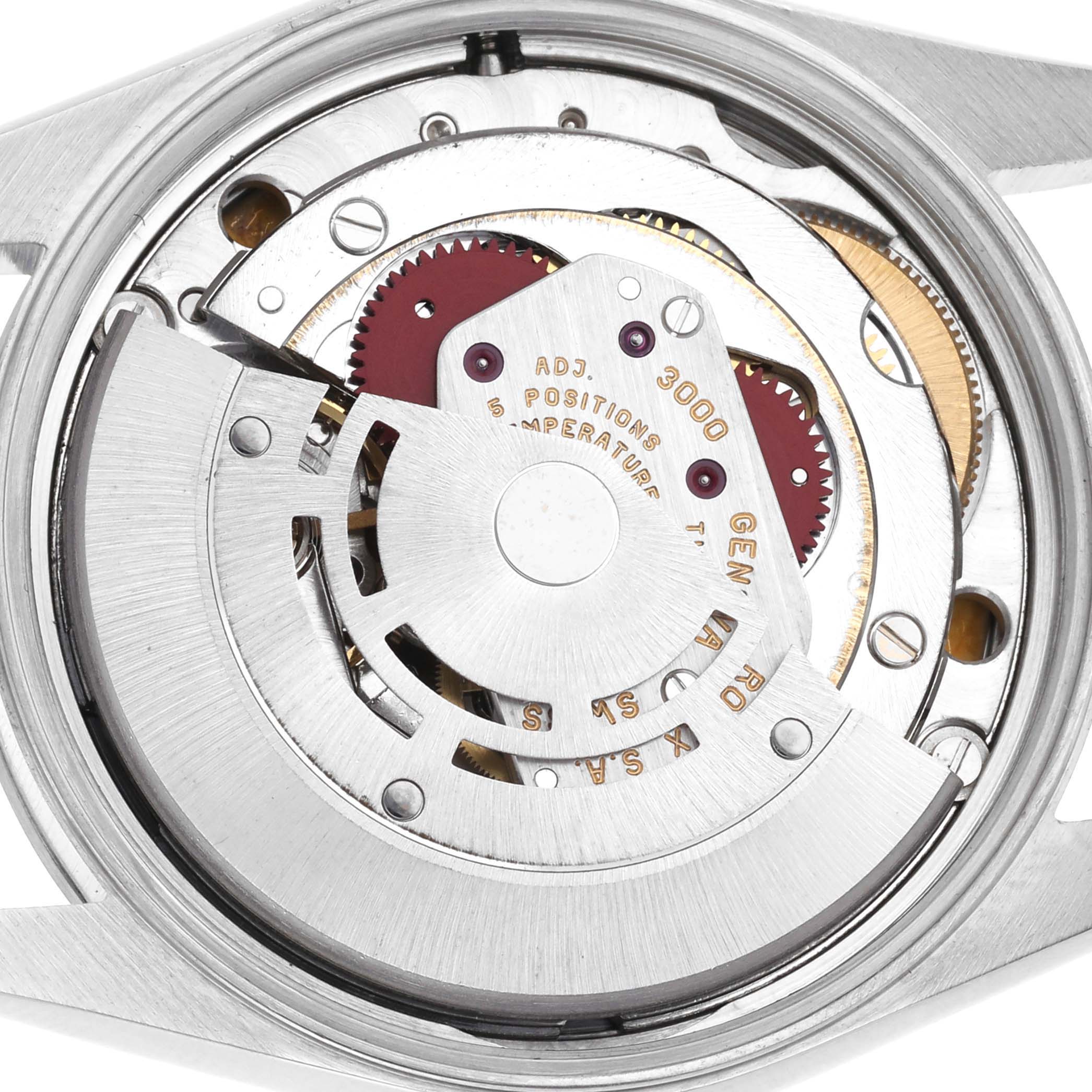 The image shows the movement of a Rolex Air-King 14000 Men's Stainless Steel Blue Dial 14000 Men's Stainless Steel Blue Dial watch from a top-down angle, highlighting its intricate gears and rotor.