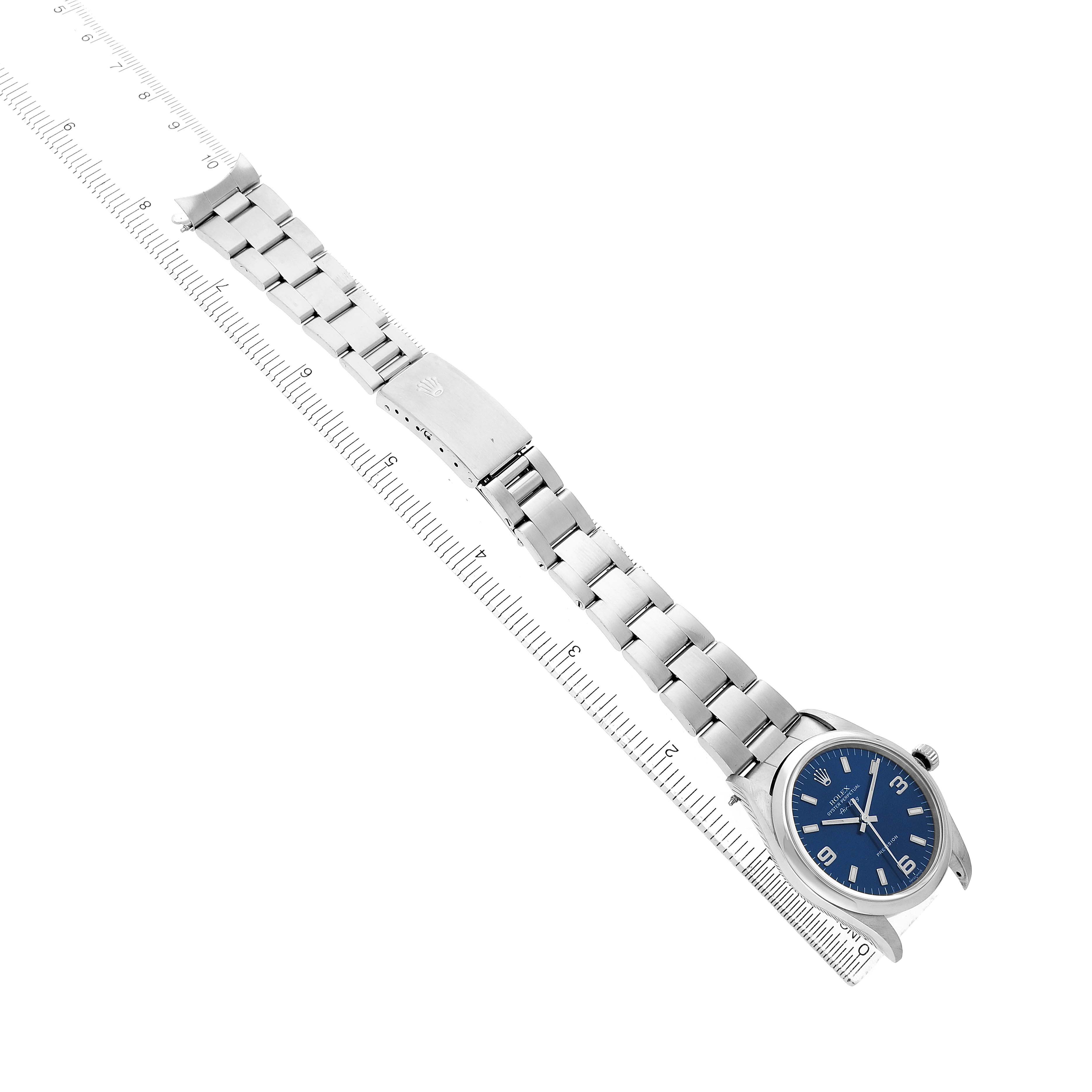 The Rolex Air-King 14000 Men's Stainless Steel Blue Dial watch is shown from an angled top view, highlighting its blue dial, case, and metal bracelet.
