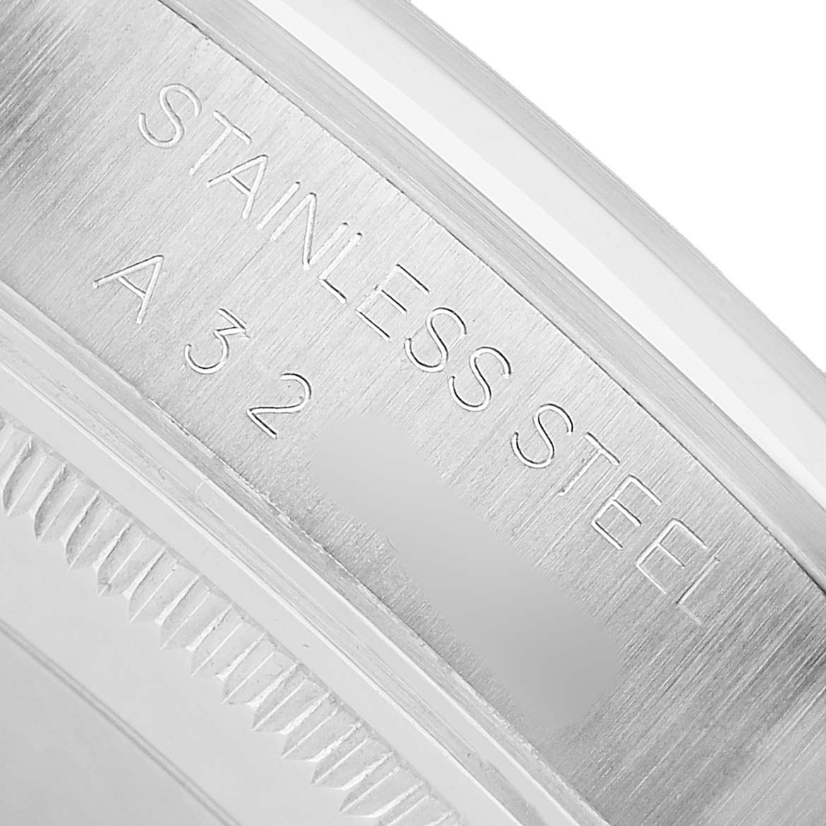 The image shows a close-up of the Rolex Air-King 14000 Men's Stainless Steel Blue Dial watch case back, highlighting the stainless steel engraving.