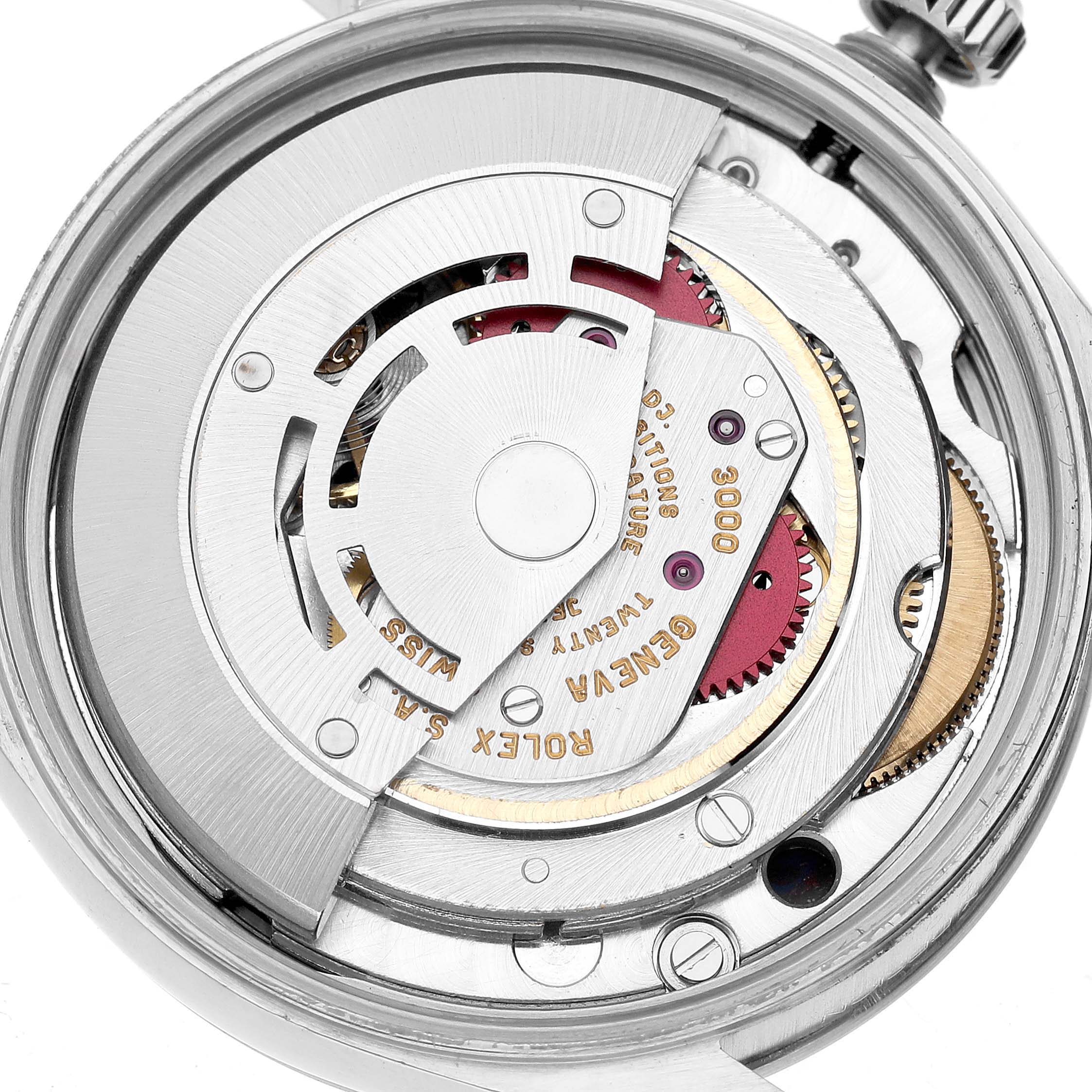 The image shows the internal mechanism of a Rolex Air-King 14000 Men's Stainless Steel Blue Dial watch, viewed from the back with visible gears and rotor.