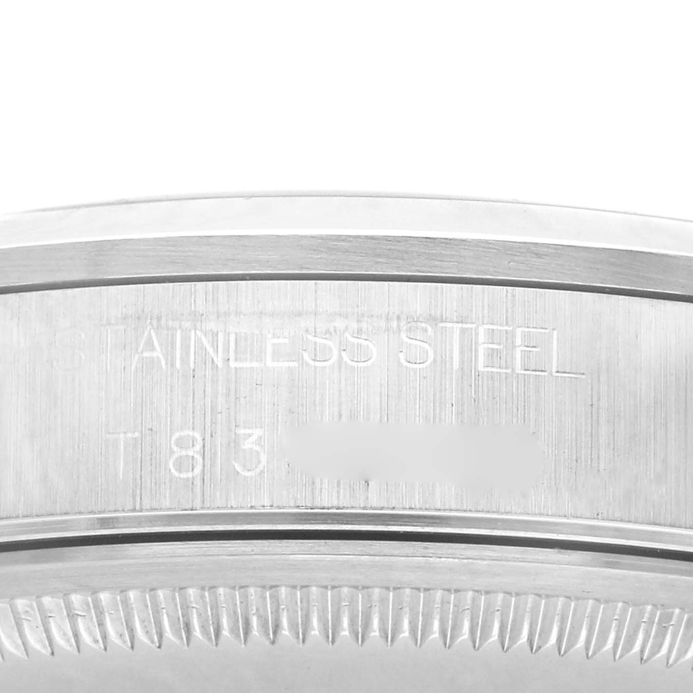 The image shows a close-up of the side of a Rolex Air-King 14000 Men's Stainless Steel Pink Dial 14000 Men's Stainless Steel Pink Dial, highlighting engravings on the stainless steel case.