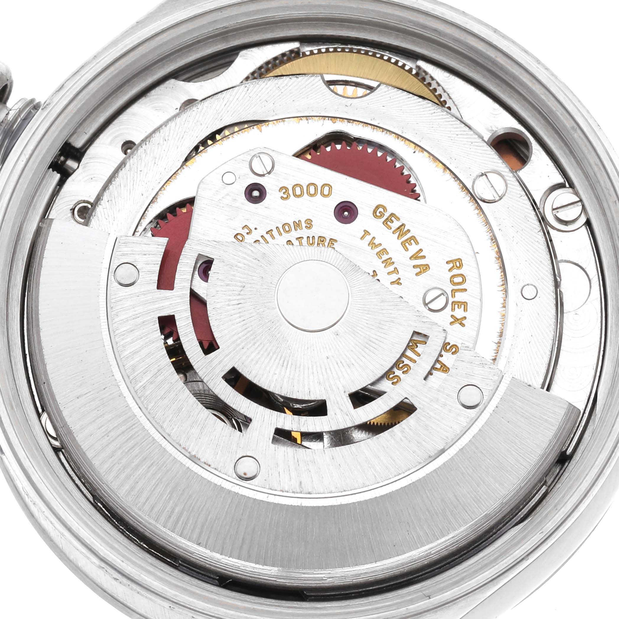 The image shows the movement of the Rolex Air-King 14000 Men's Stainless Steel Pink Dial 14000 Men's Stainless Steel Pink Dial watch, highlighting its intricate rotor and mechanical components.