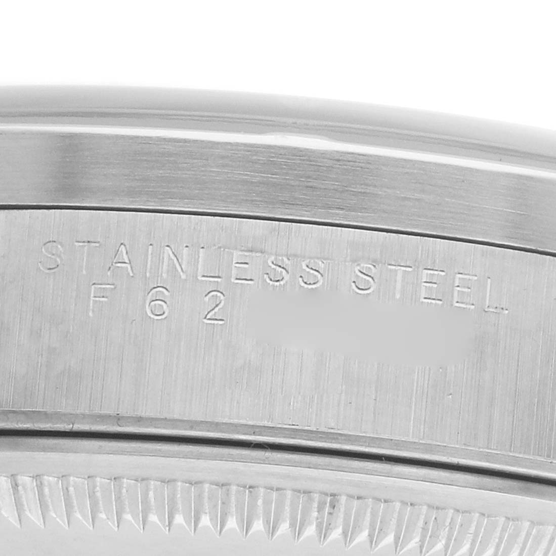 The close-up image shows the stainless steel case back and model engraving of a Rolex Date 15210 Men's Stainless Steel Silver Dial watch.