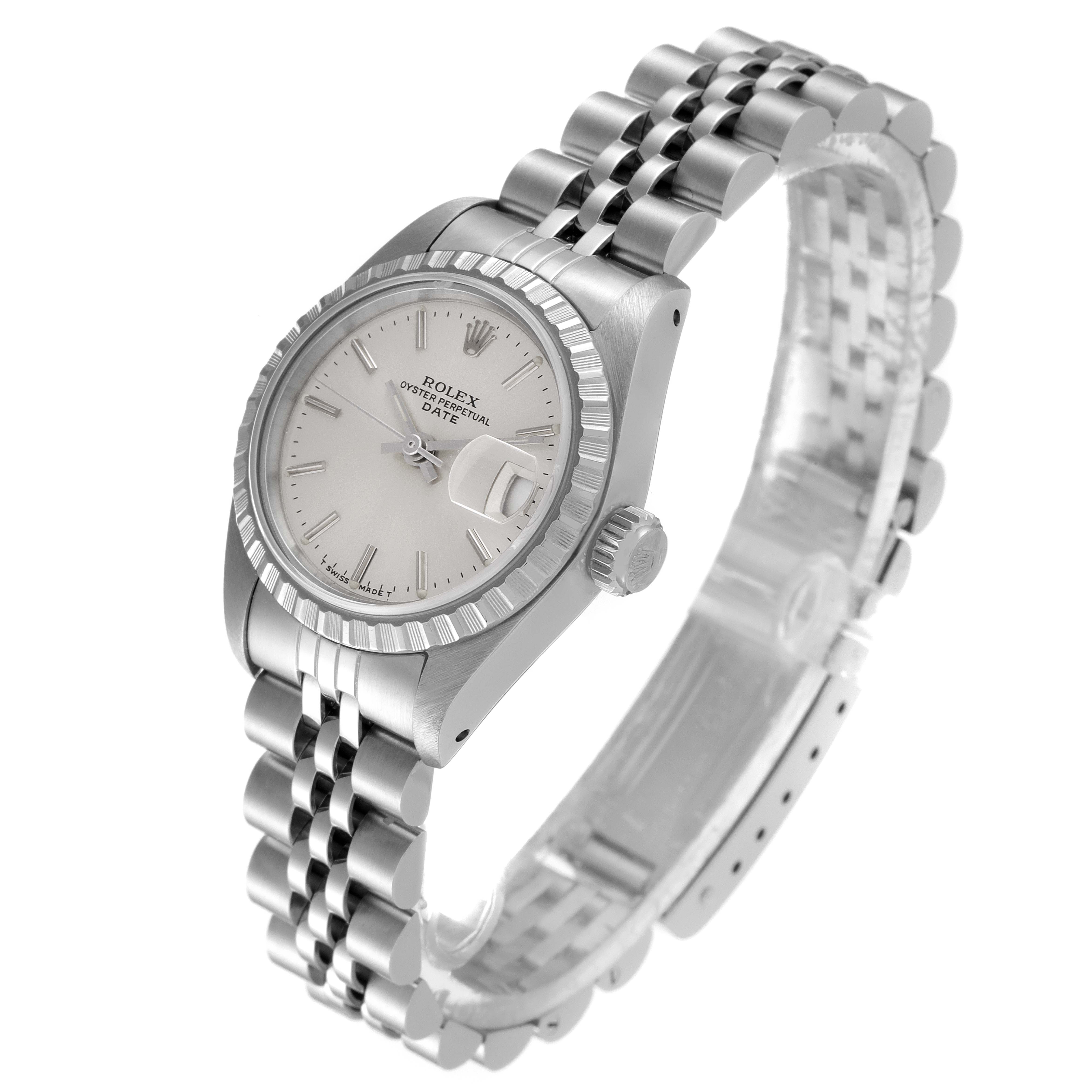 The image shows a Rolex Date 69240 Women's Stainless Steel Silver Dial 69240 Women's Stainless Steel Silver Dial watch from an oblique angle, highlighting the face, fluted bezel, crown, and jubilee bracelet.