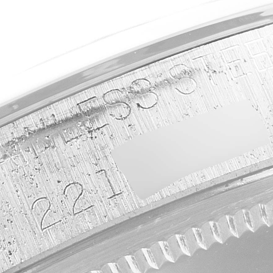 The image shows a close-up view of the engraved inner bezel of a Rolex Date 1500 Men's Stainless Steel Silver Dial 1500 Men's Stainless Steel Silver Dial model watch.