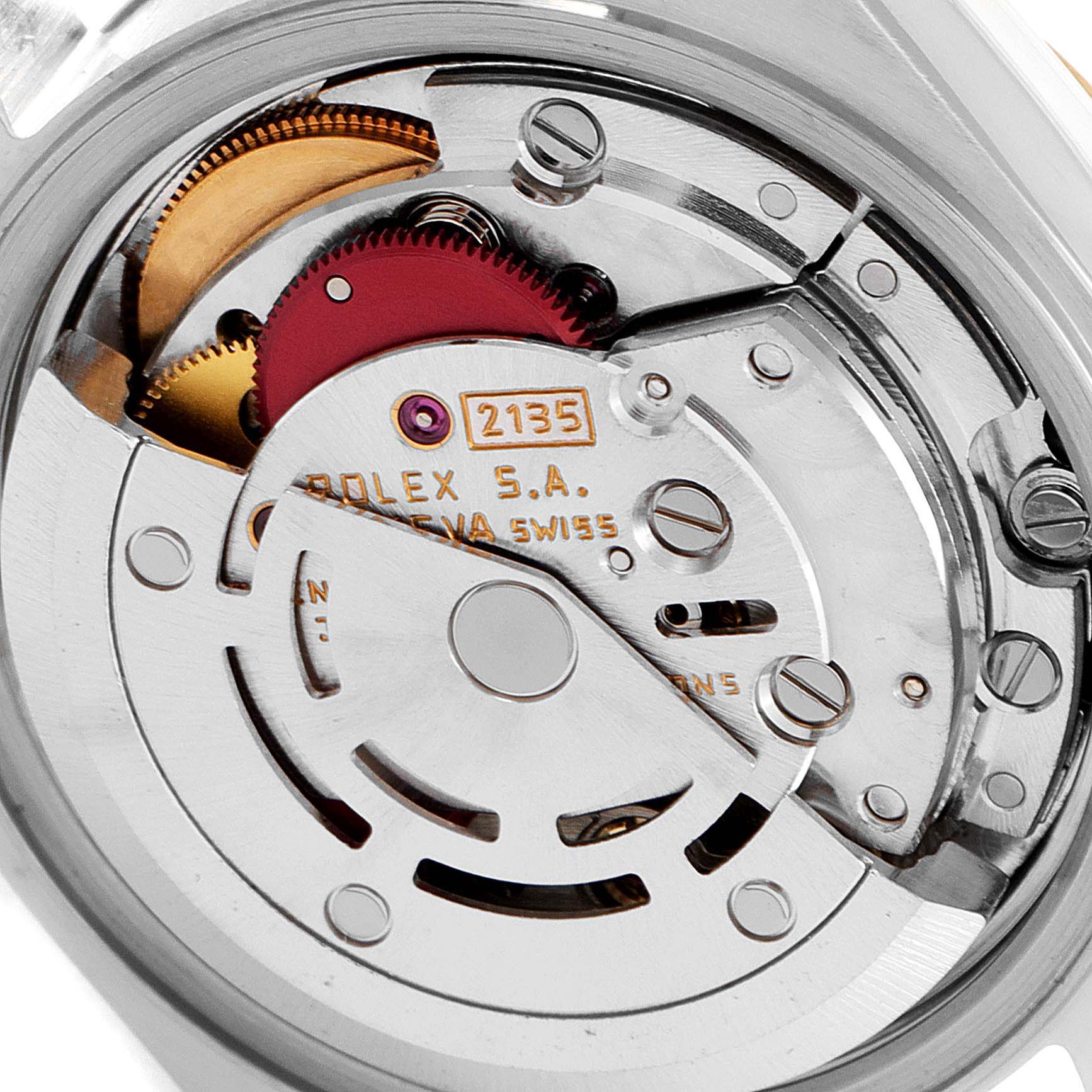 The image shows a close-up of the movement mechanism inside a Rolex Datejust 69173 Women
s Steel and Gold (two tone) Champagne Dial 69173 Women
s Steel and Gold (two tone) Champagne Dial watch.