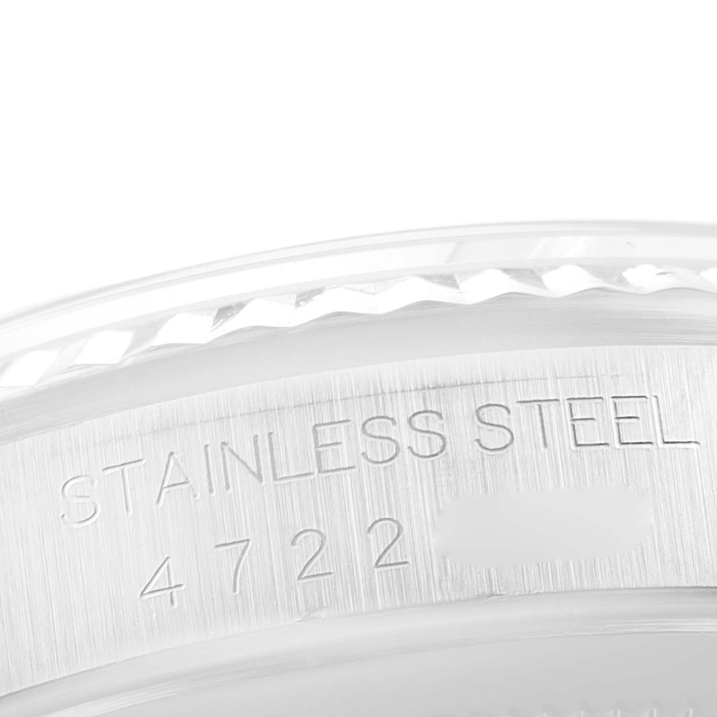The image shows a close-up of the stainless steel case back of a Rolex Datejust 16234 Men's Stainless Steel Silver Dial 16234 Men's Stainless Steel Silver Dial model, highlighting the engraved text.