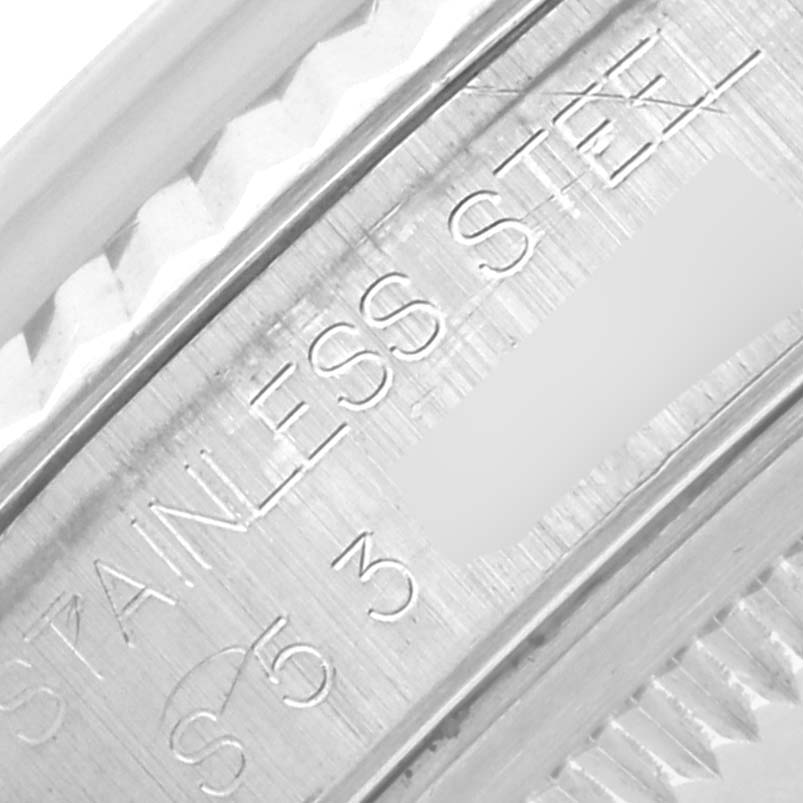 The image shows a close-up of the edge and engravings on a Rolex Datejust 16234 Men's Stainless Steel Silver Dial 16234 Men's Stainless Steel Silver Dial watch case, highlighting the "STAINLESS STEEL" marking.