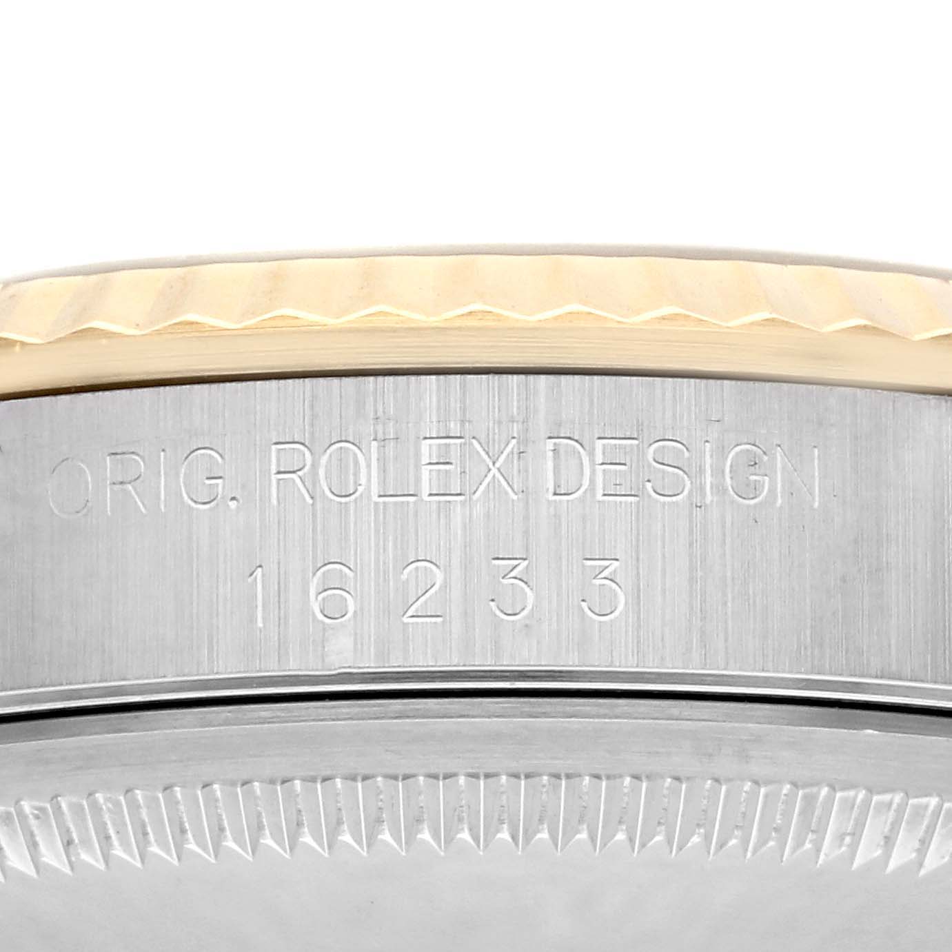 The image shows the side of a Rolex Datejust 16233 Men's Steel and Gold (two tone) Champagne Dial 16233 Men's Steel and Gold (two tone) Champagne Dial watch case with model number 16233 engraved.