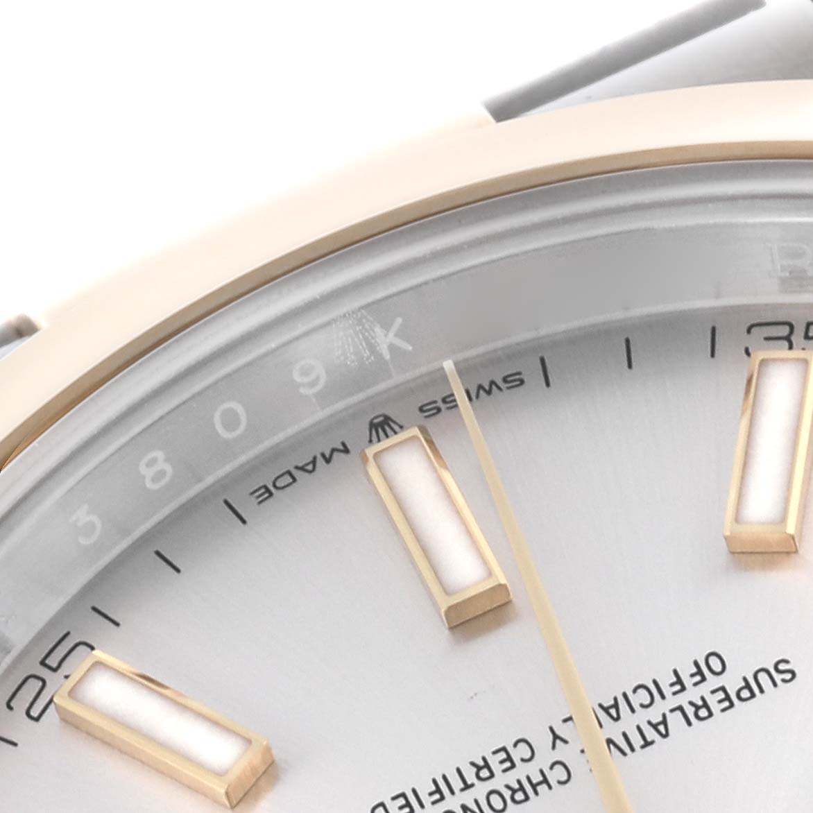 The image shows a close-up of the dial and indices of a Rolex Datejust 41 126303 Men's Steel and Gold (two tone) Silver Dial 126303 Men's Steel and Gold (two tone) Silver Dial, highlighting the "Swiss Made" text.