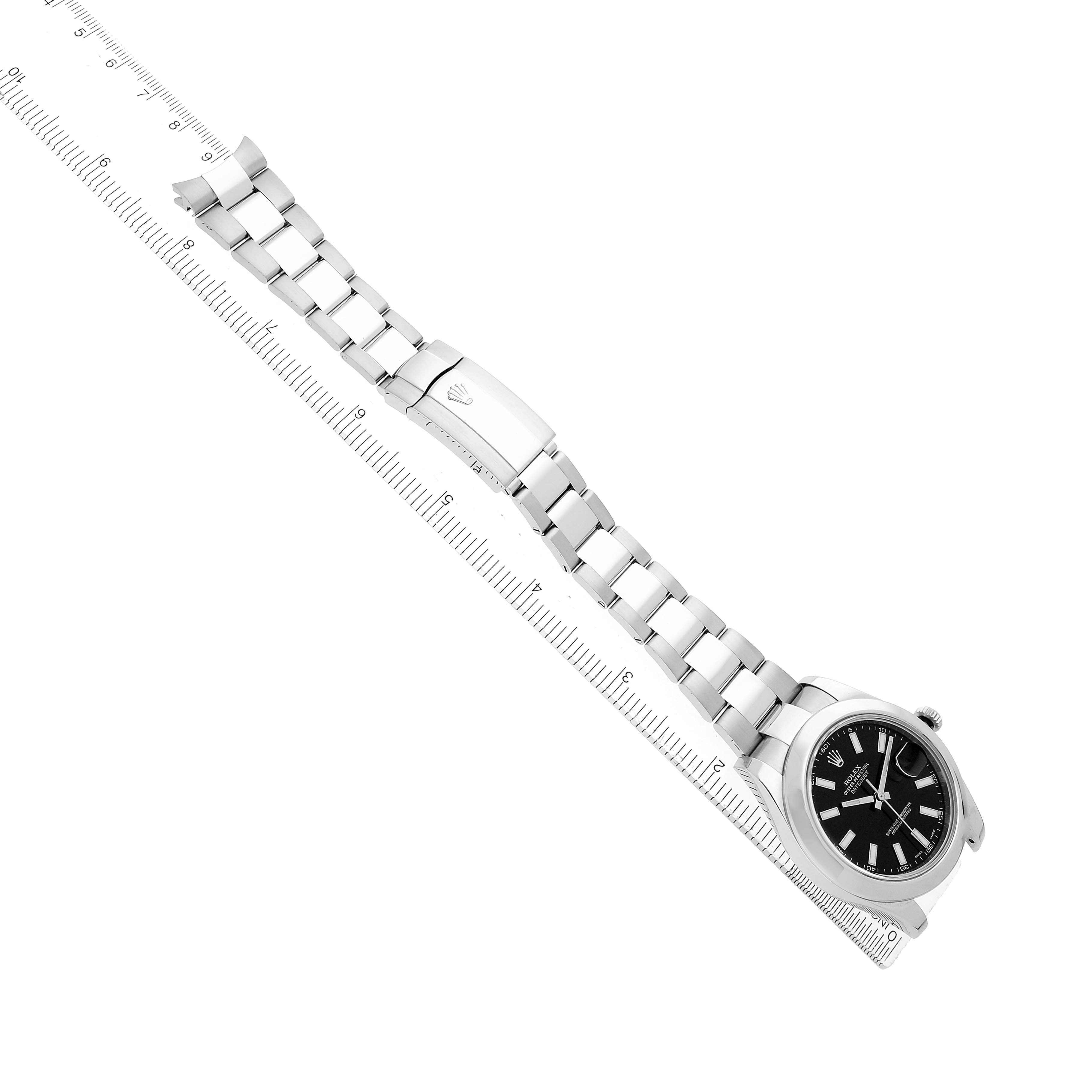 The Rolex Datejust 41 116300 Men's Stainless Steel Black Dial watch is displayed diagonally, showing the full bracelet, clasp, and watch face against a ruler.