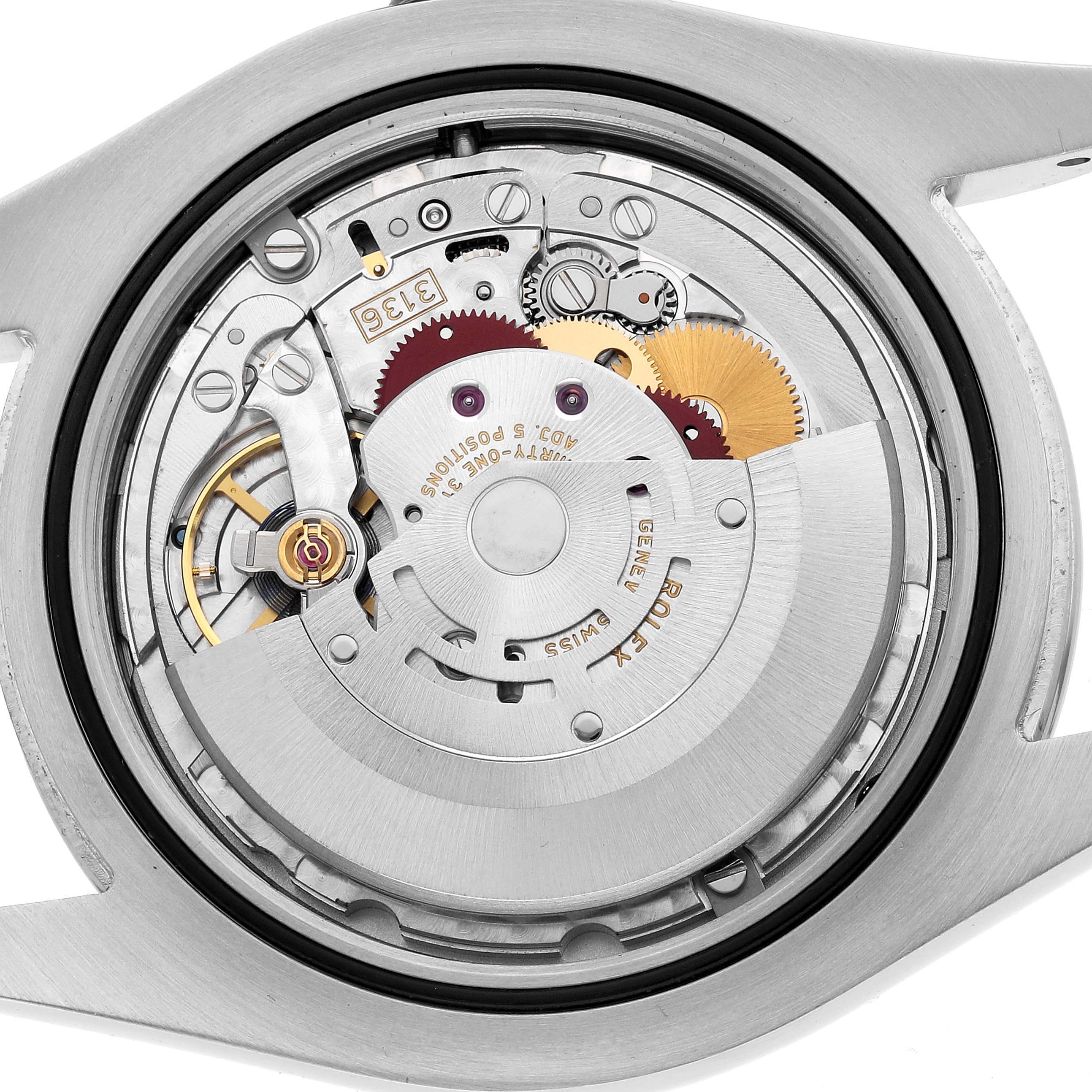 The image shows the movement of a Rolex Datejust 41 116300 Men's Stainless Steel Black Dial from the back, revealing its intricate gears and mechanisms.