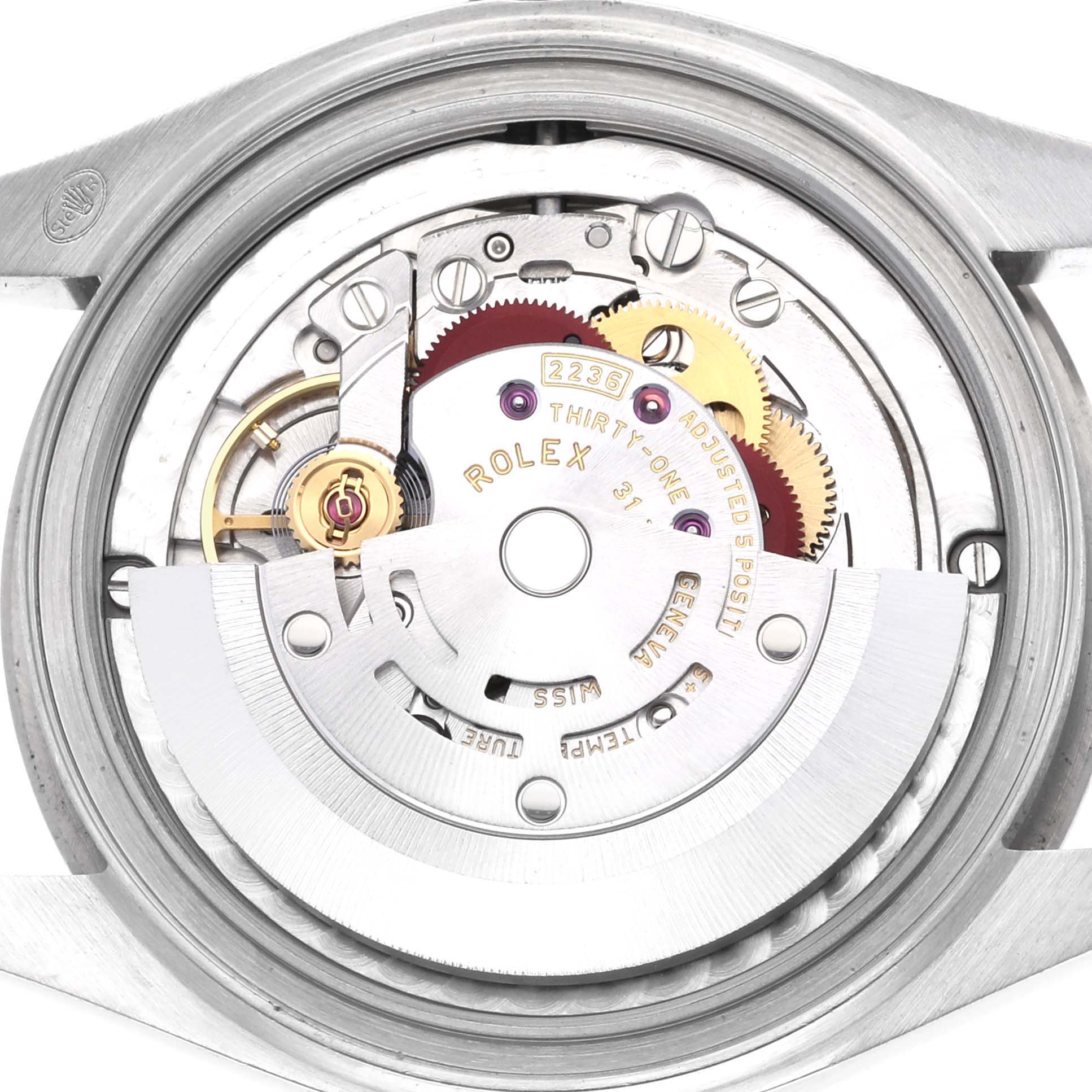 The image shows the internal mechanics of a Rolex Mid-Size 278274 Women's Stainless Steel Green Dial 278274 Women's Stainless Steel Green Dial watch from a back view, revealing its movement components.