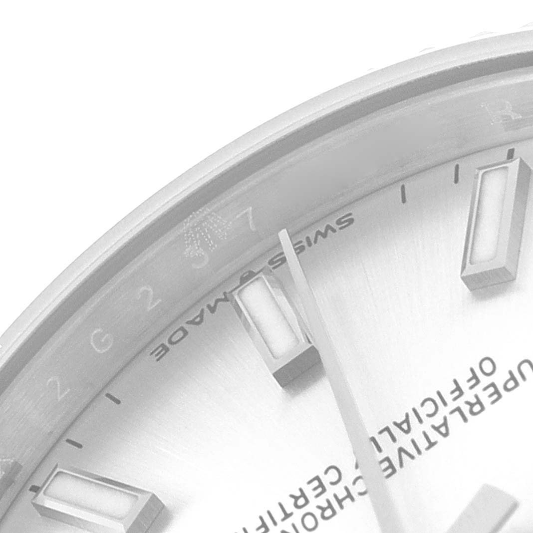 The image shows a close-up of the dial and bezel of a Rolex Mid-Size 278274 Women
s Stainless Steel Silver Dial 278274 Women
s Stainless Steel Silver Dial watch.