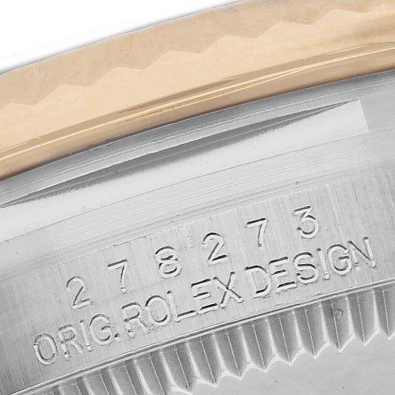 The image shows a close-up of the case side with engraved model number and "Orig. Rolex Design" on a Mid-Size Rolex watch.