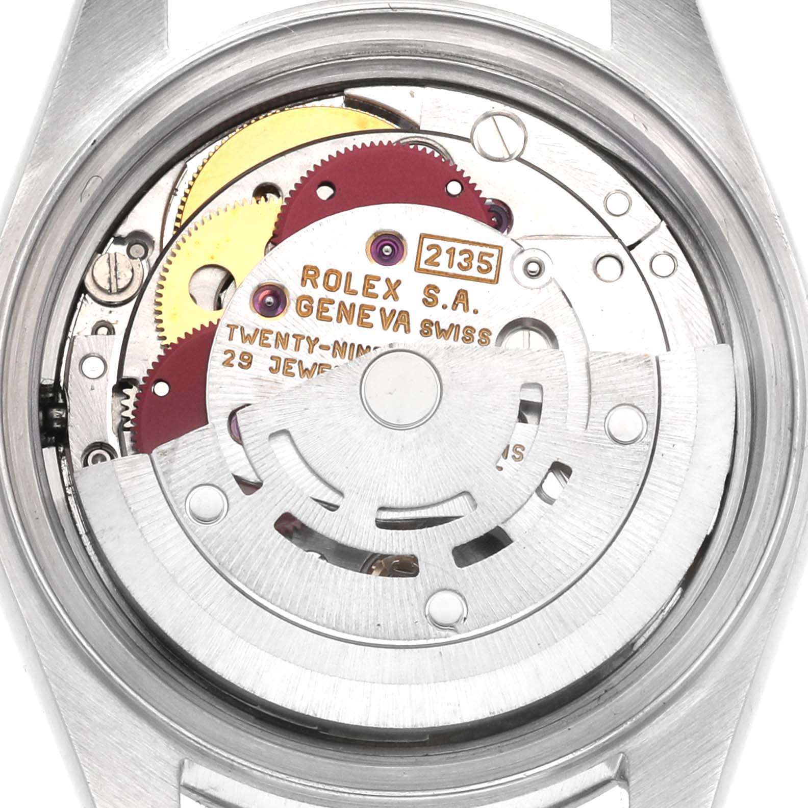 The image shows the inner mechanics of a Rolex Datejust 69160 Women's Stainless Steel Pink Dial 69160 Women's Stainless Steel Pink Dial watch from a back view, highlighting the movement and gears.