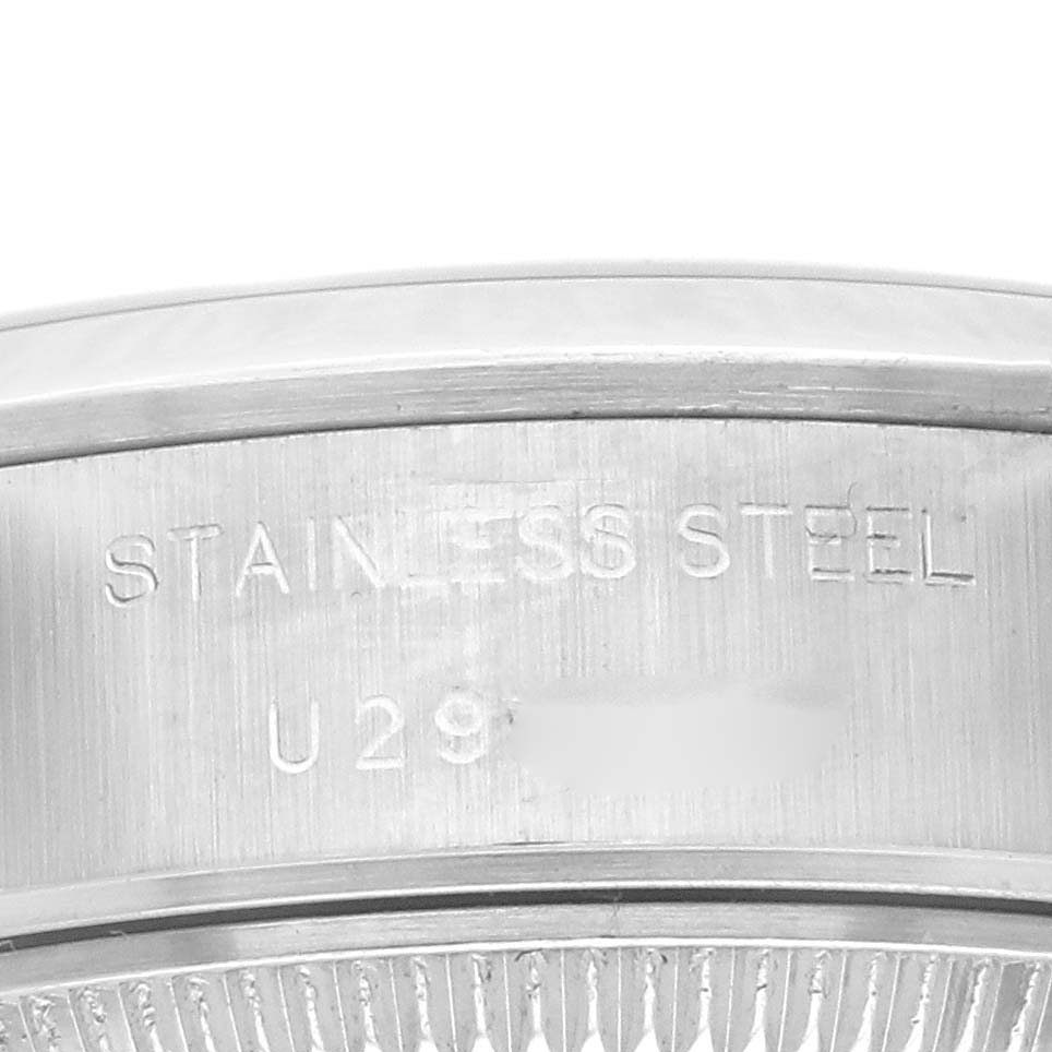 The image shows the side view of the case back and rehaut engraving of a Rolex Datejust 69160 Women's Stainless Steel Pink Dial 69160 Women's Stainless Steel Pink Dial with "STAINLESS STEEL" marked.