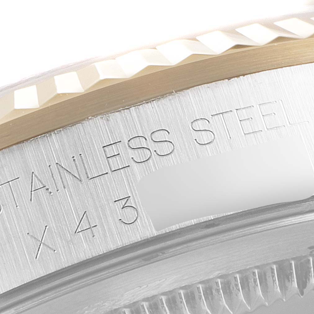 This close-up image shows the stainless steel case and fluted bezel of a Rolex Datejust 16233 Men
s Steel and Gold (two tone) Champagne Dial 16233 Men
s Steel and Gold (two tone) Champagne Dial watch.